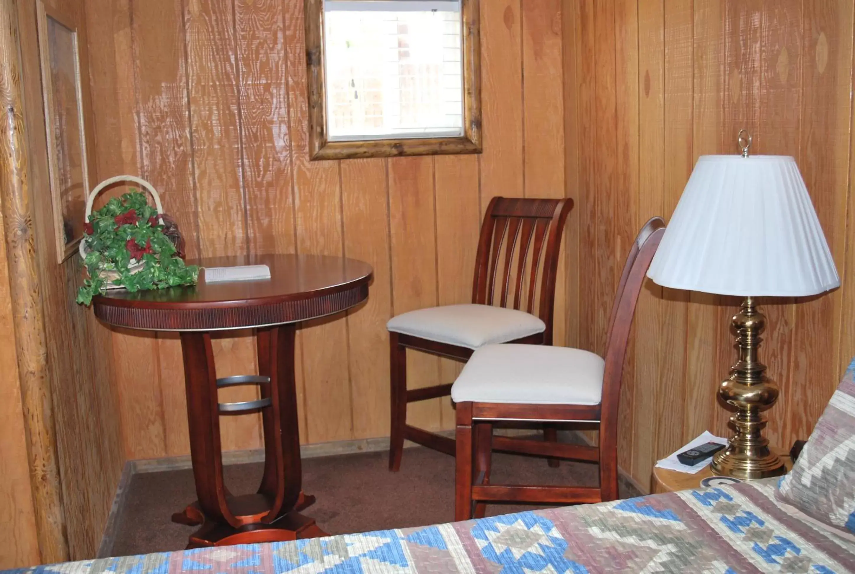 Bedroom, Seating Area in Cowboy Country Inn