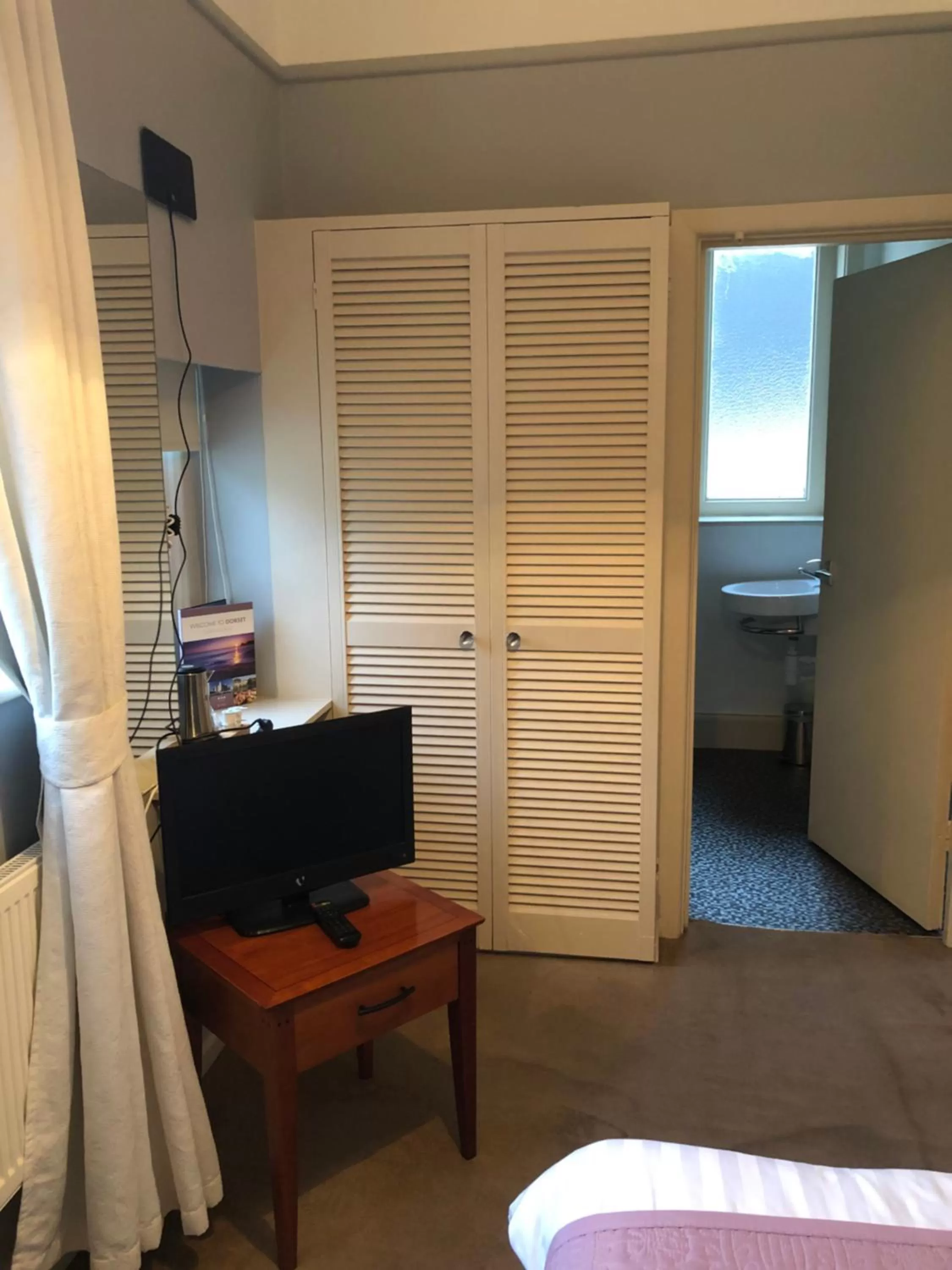 Photo of the whole room, TV/Entertainment Center in Cottonwood Boutique