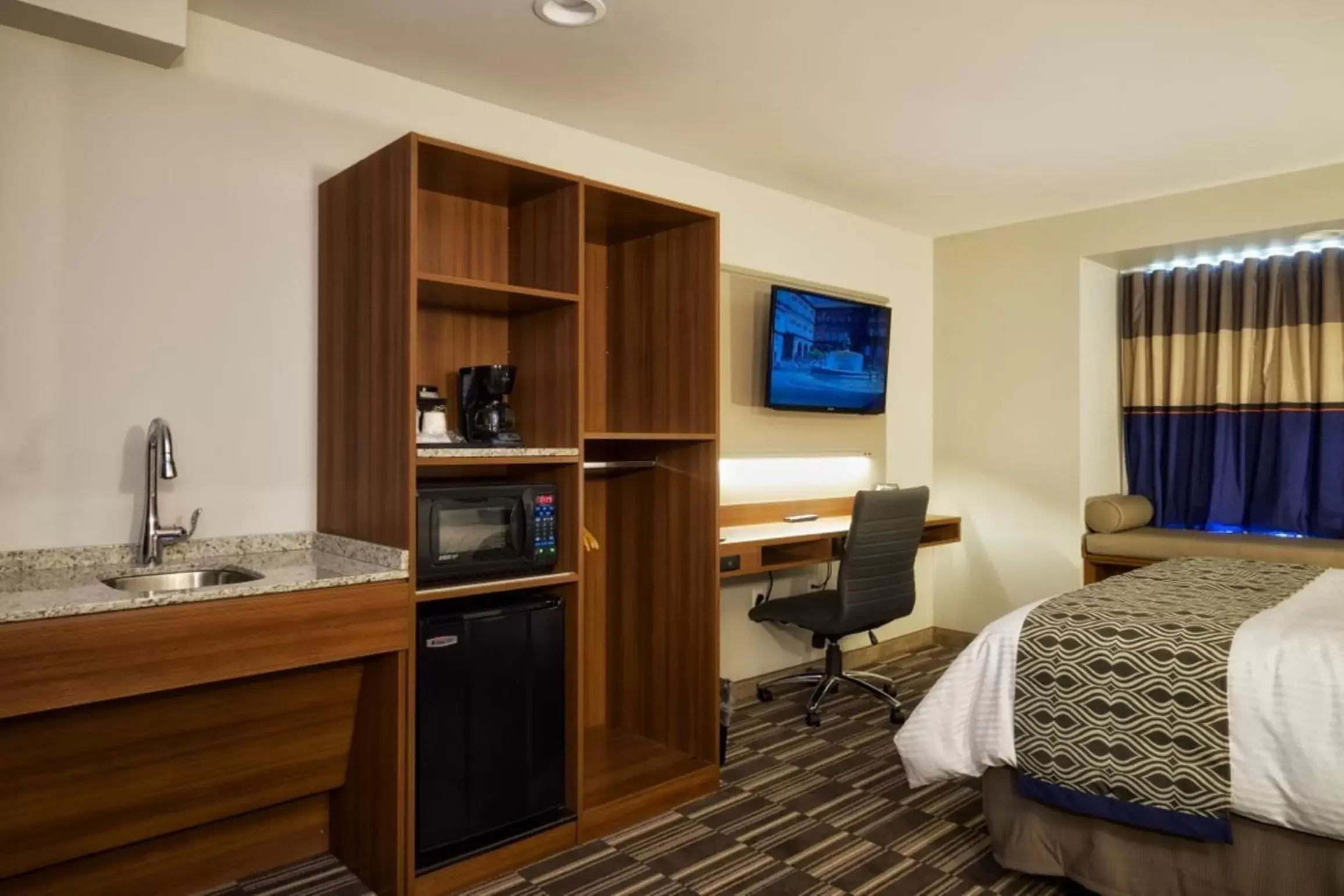 TV and multimedia, TV/Entertainment Center in Microtel Inn & Suites Sault Ste. Marie