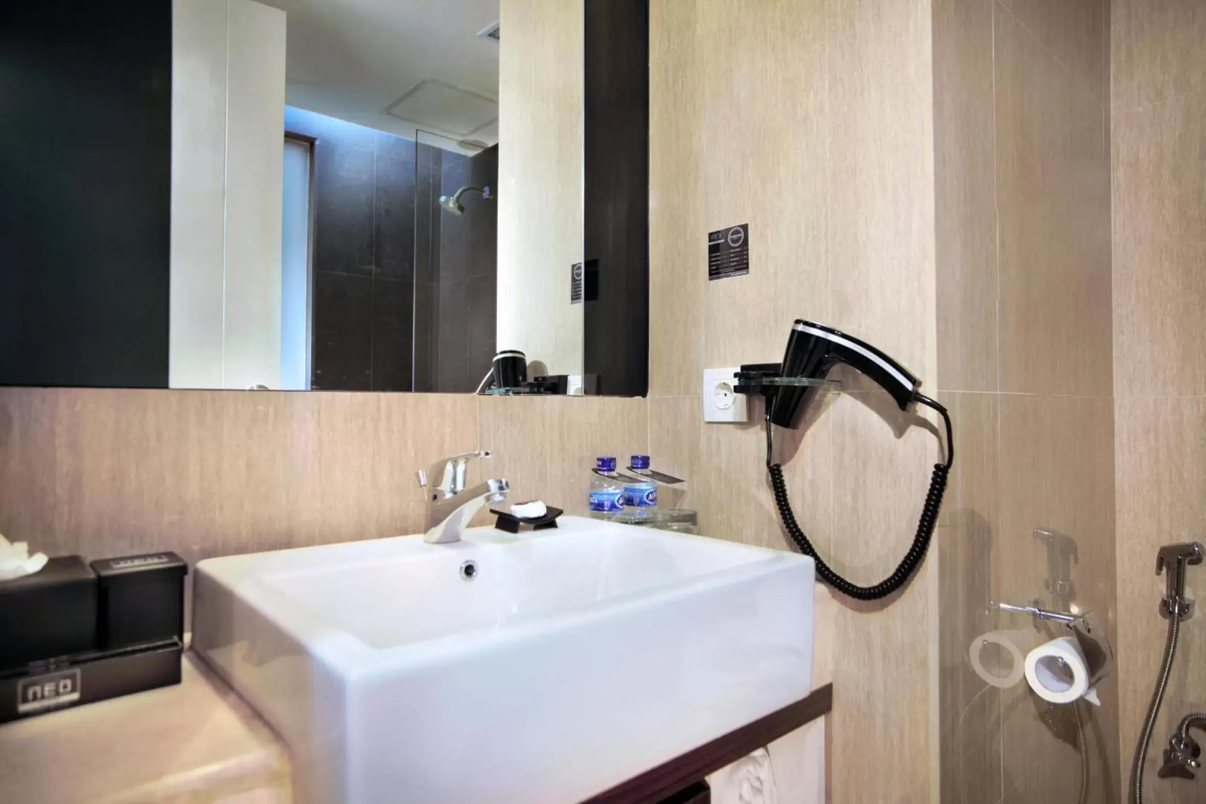 Bathroom in Neo Hotel Mangga Dua by ASTON