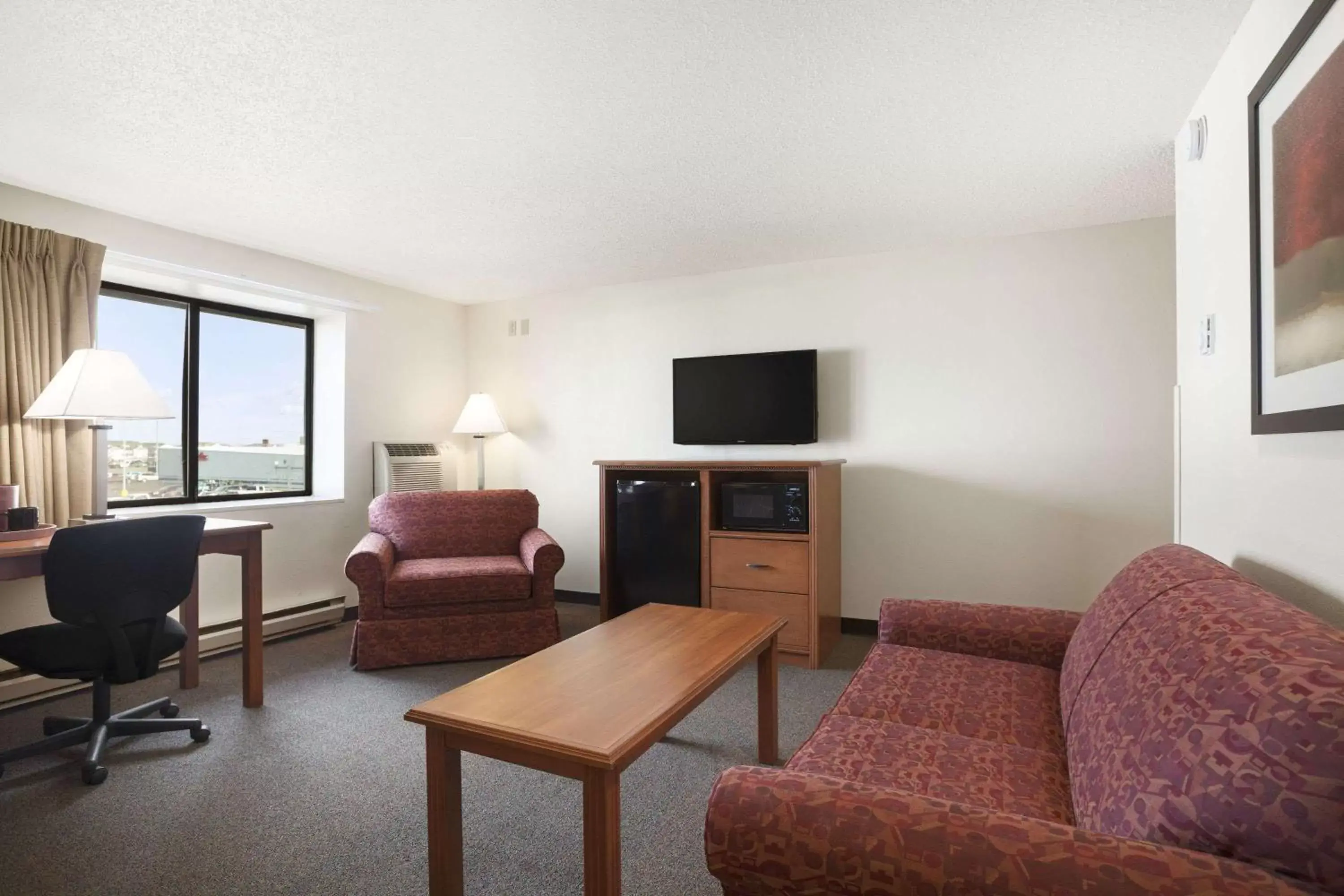 Photo of the whole room, Seating Area in Super 8 by Wyndham Williston ND