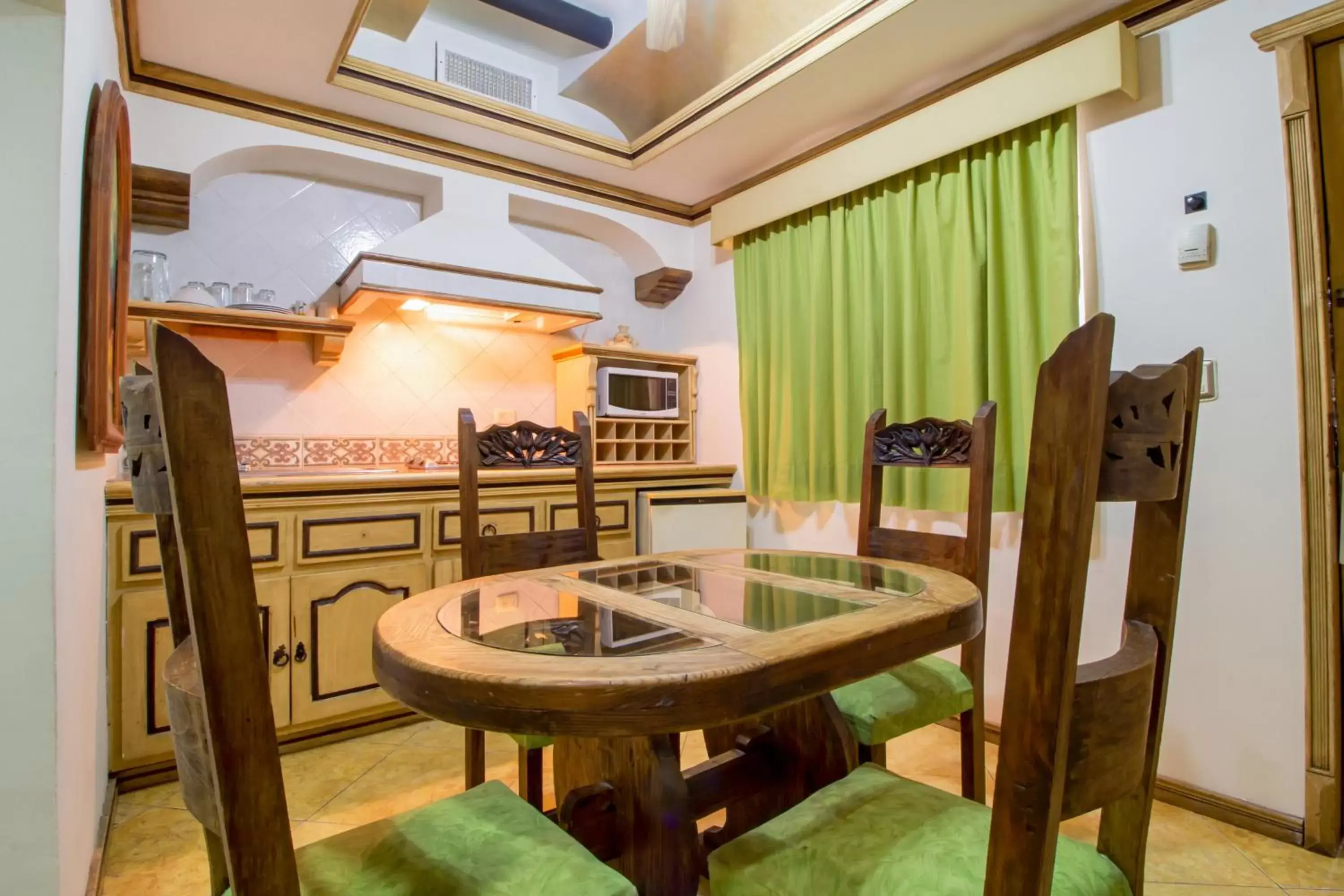 Kitchen or kitchenette in Suites Flamboyanes