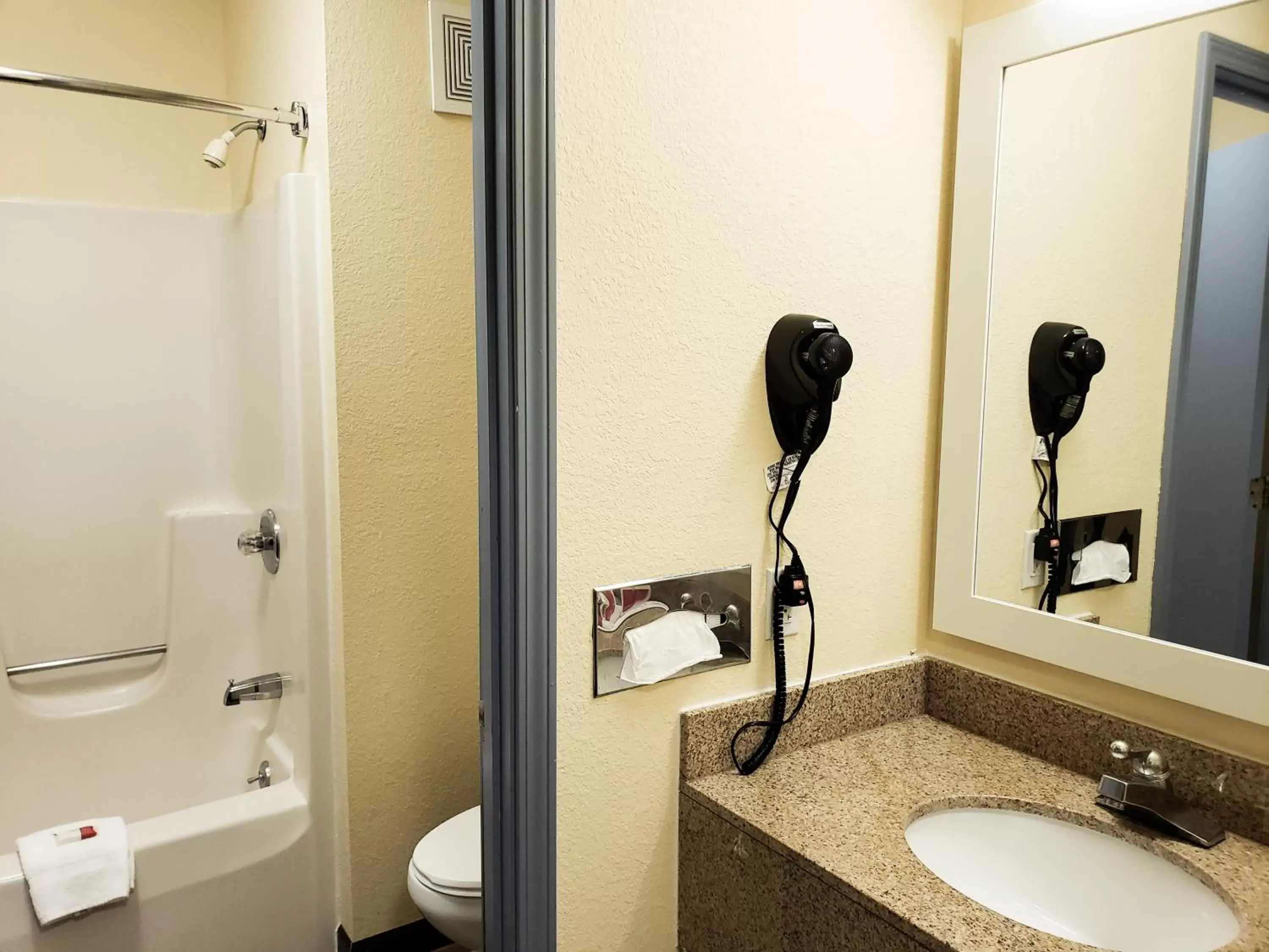 Bathroom in Days Inn & Suites by Wyndham Merrillville