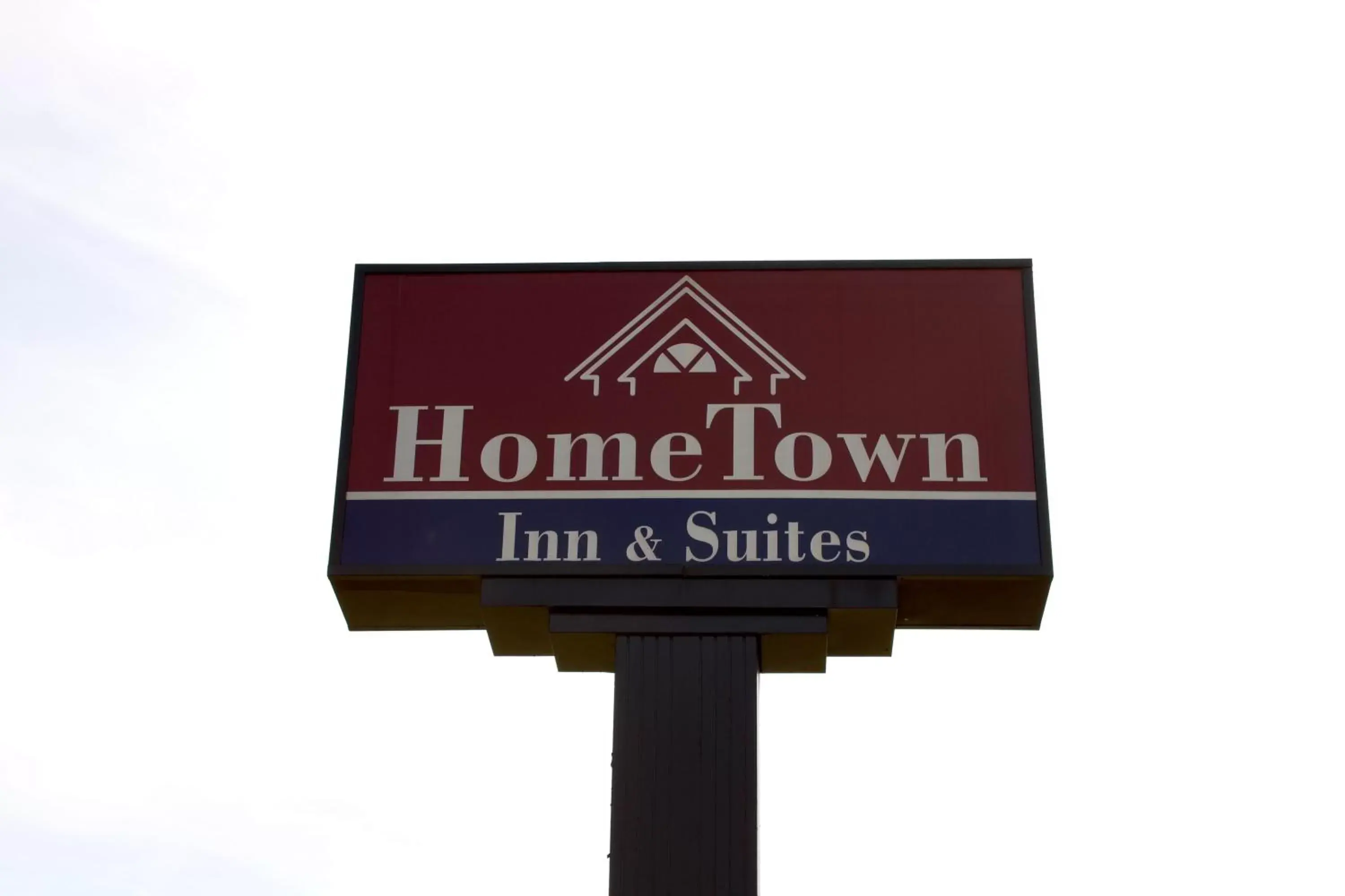 Property logo or sign in HomeTown Inn & Suites