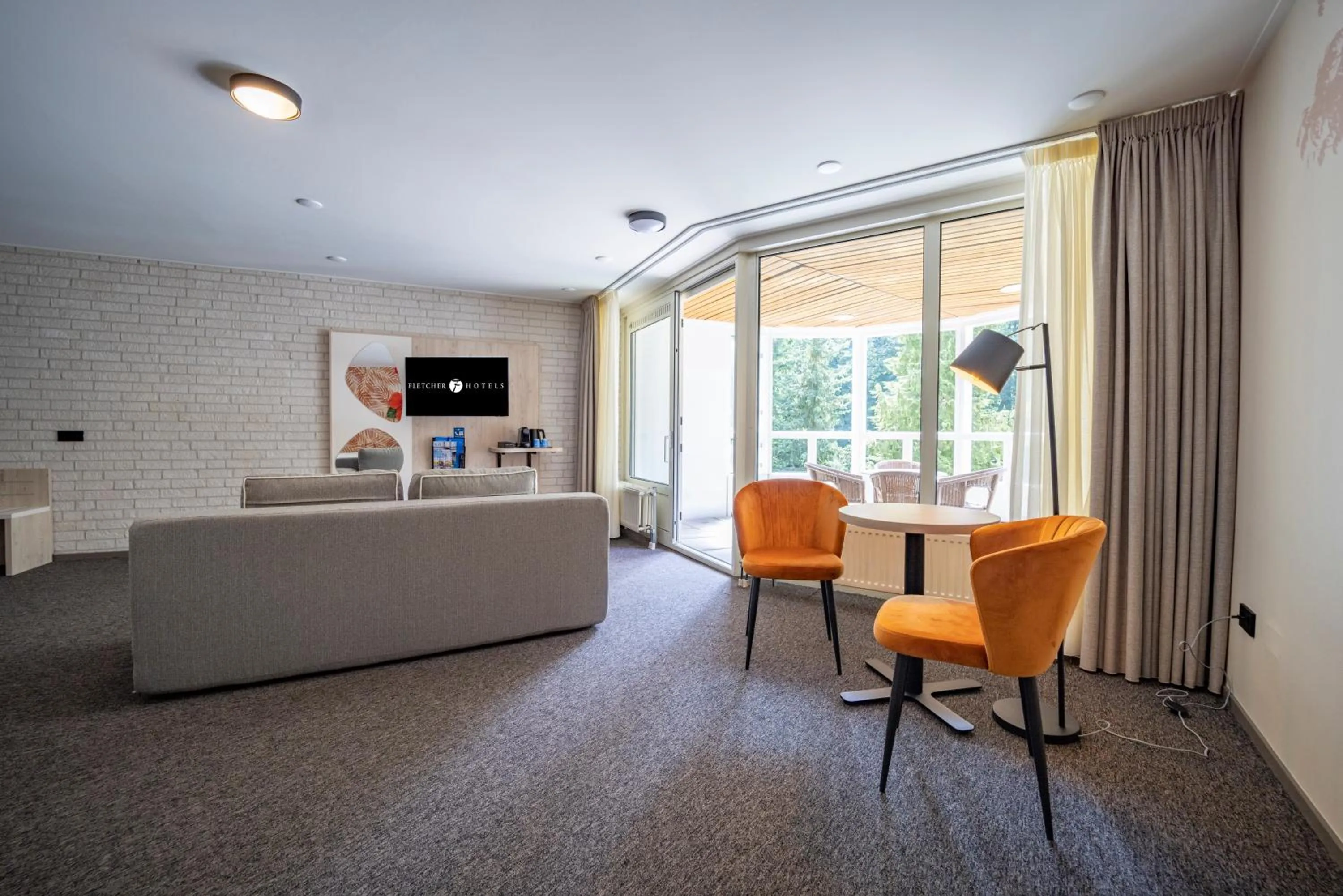 Seating area in Fletcher Hotel-Restaurant De Scheperskamp