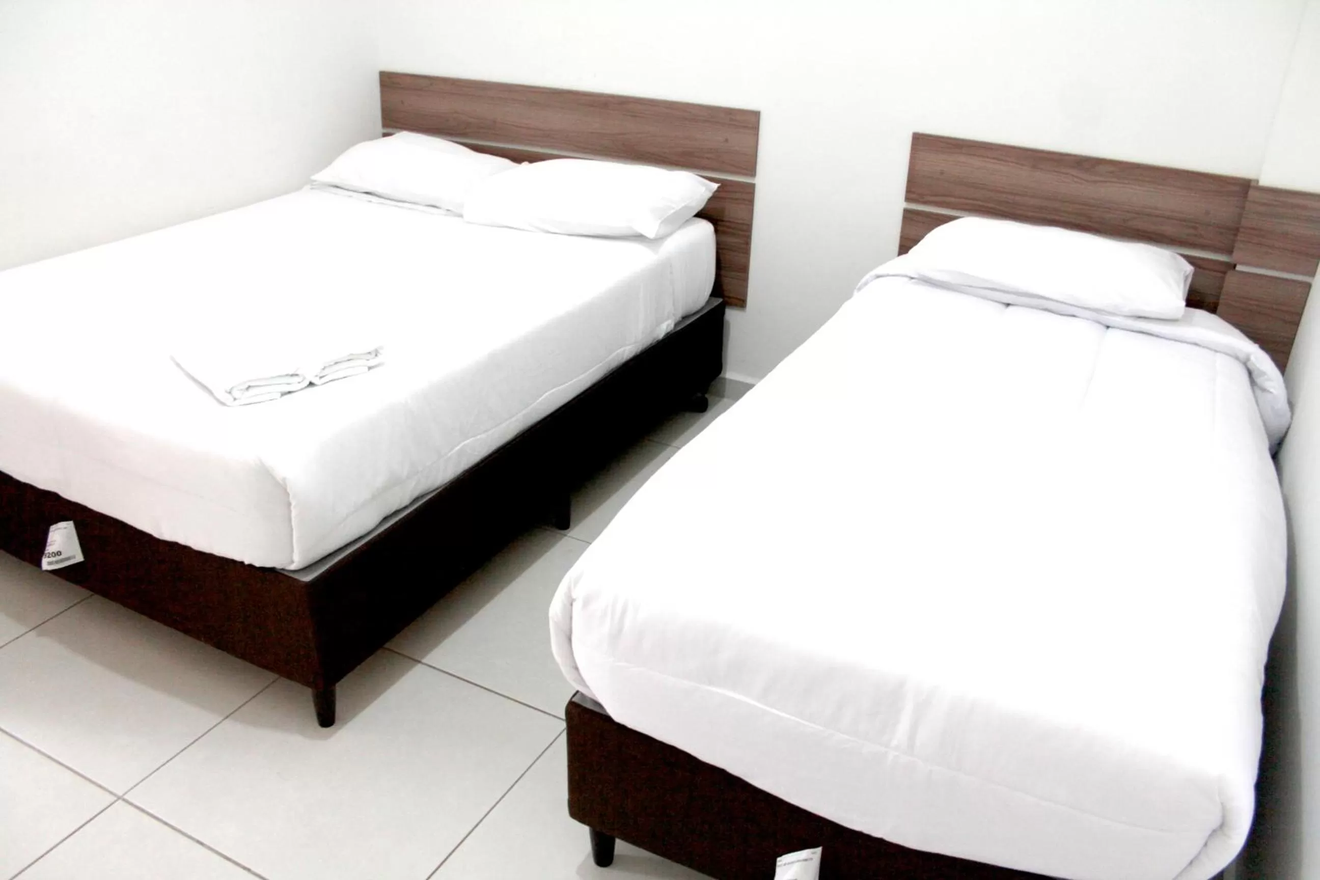 Bed in Leati's Hotel