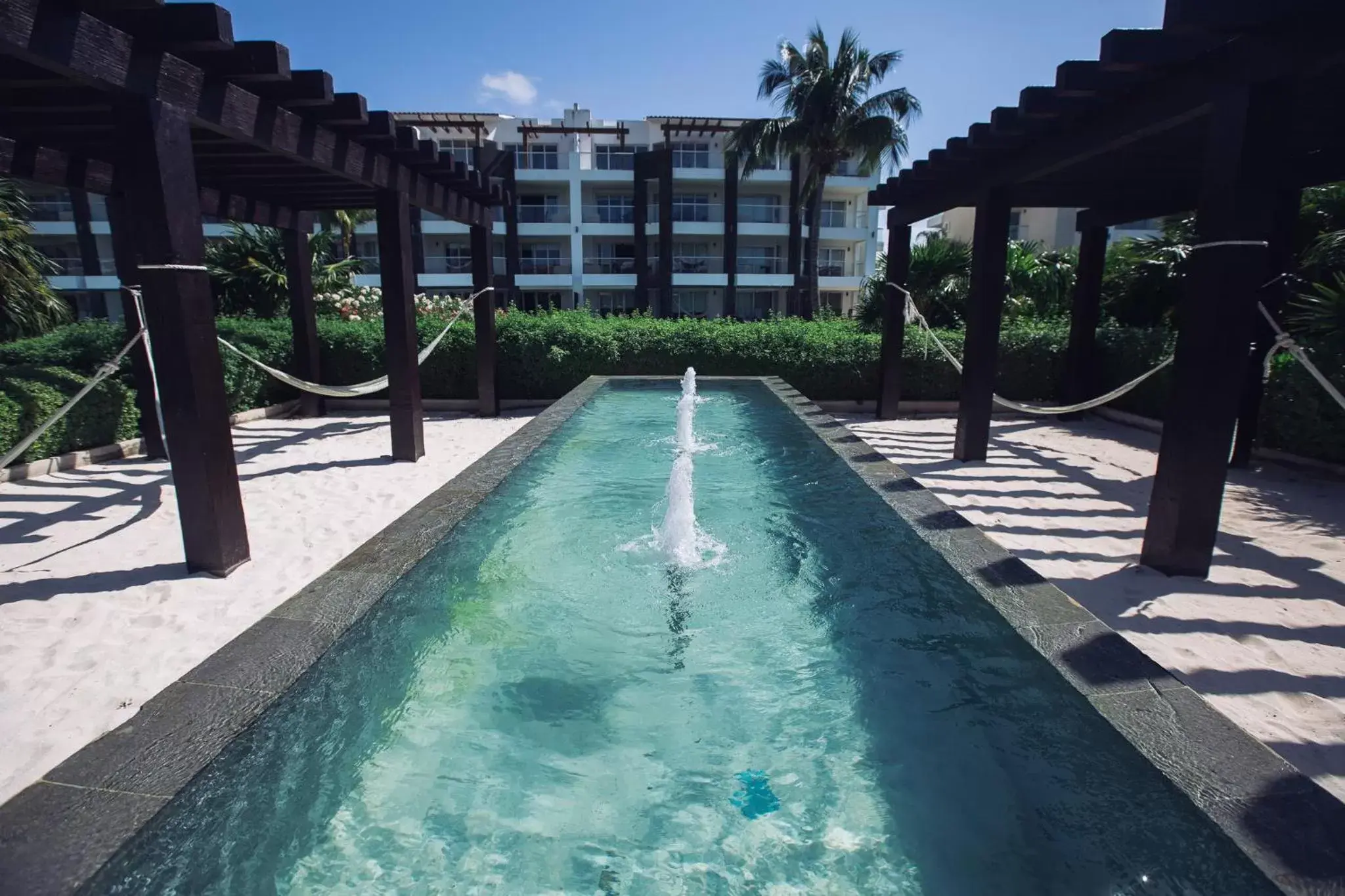 Property building, Swimming Pool in Mareazul Beach Front Condos At playa del Carmen