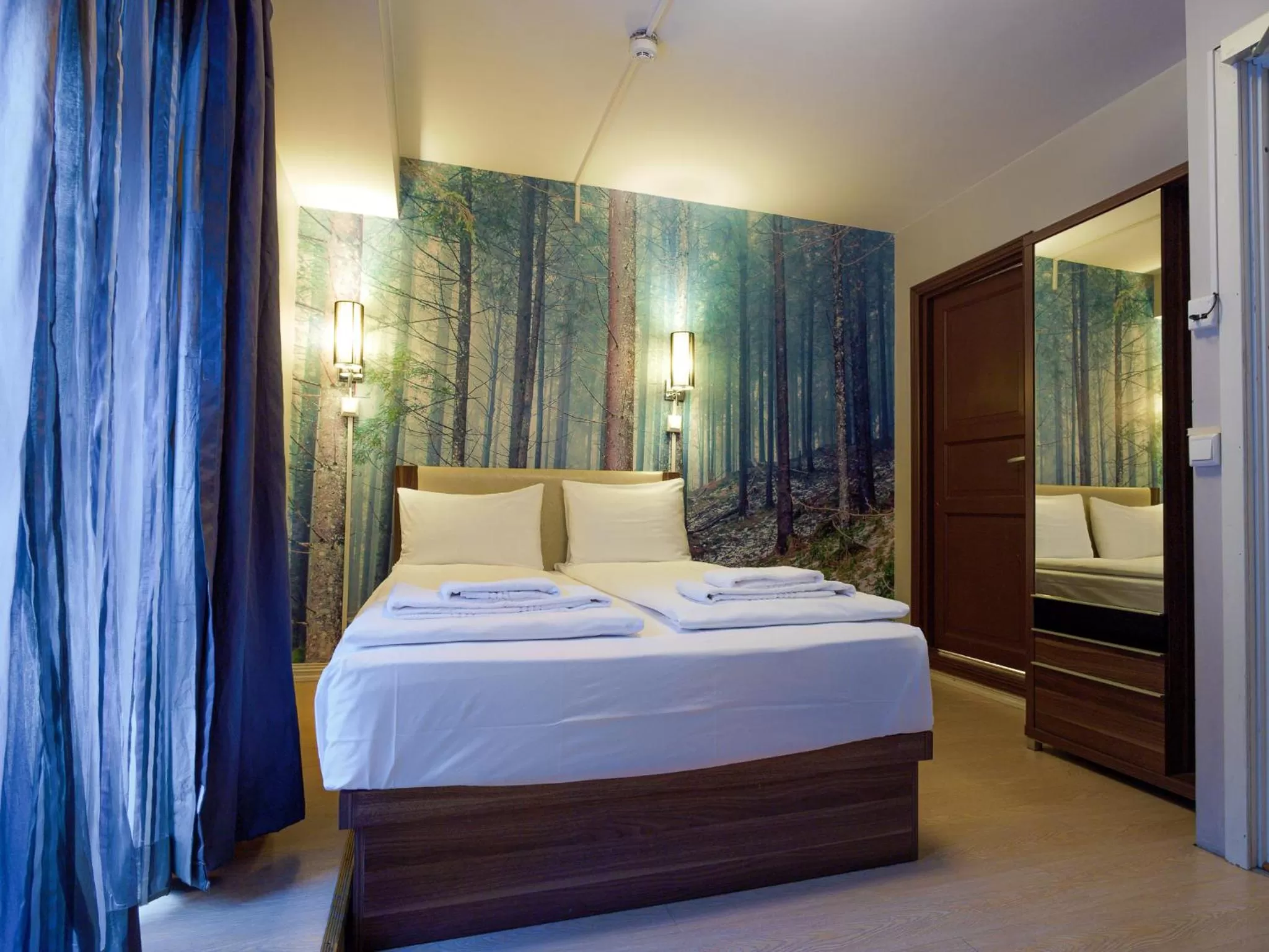 Bed in Central City Apartments