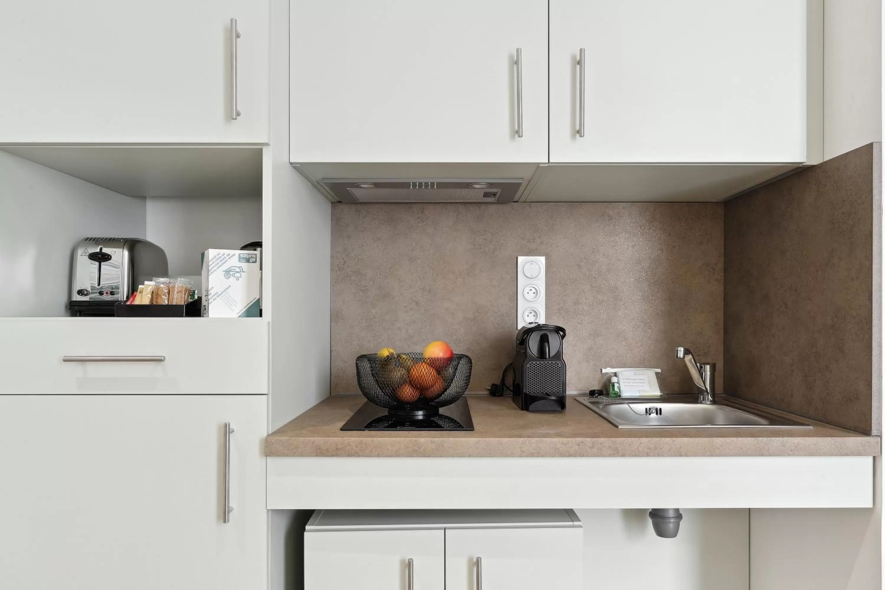 Kitchen or kitchenette in All Suites Appart Hôtel - Noisy-le-Grand