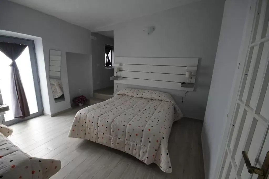 Bedroom, Bed in Locazione Turistica Domus Re
