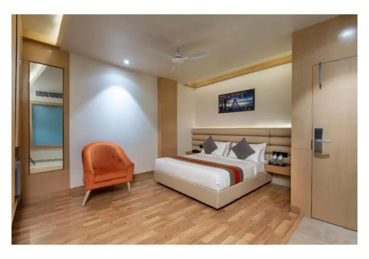 Bed in Hotel Arihant By DLS Hotels