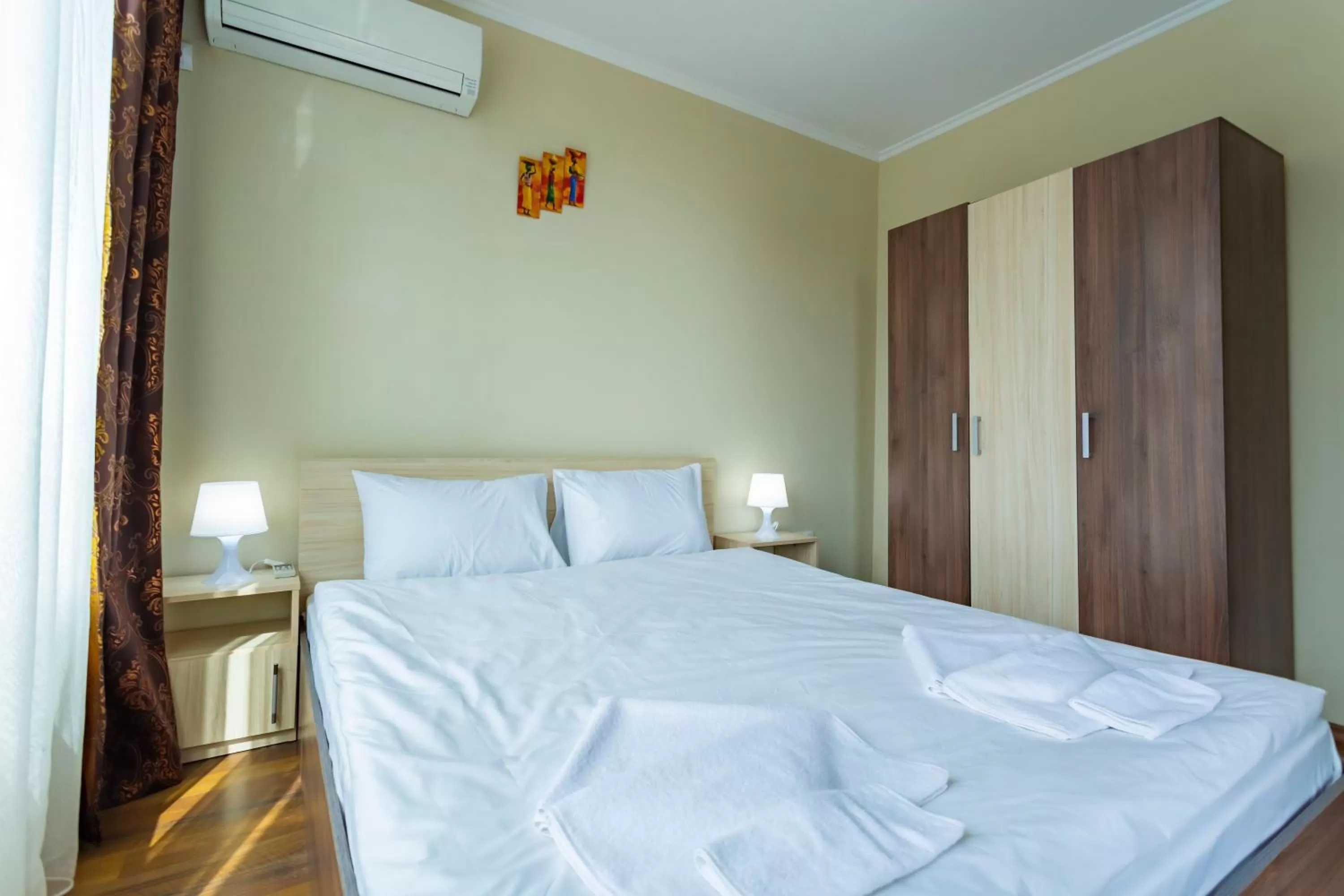 Bed in Rose Gardens Apart Hotel