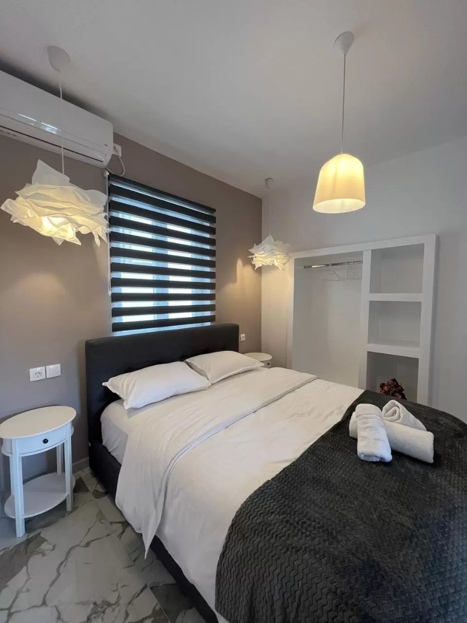 Bed in Elefsinian Mysteries Apartments