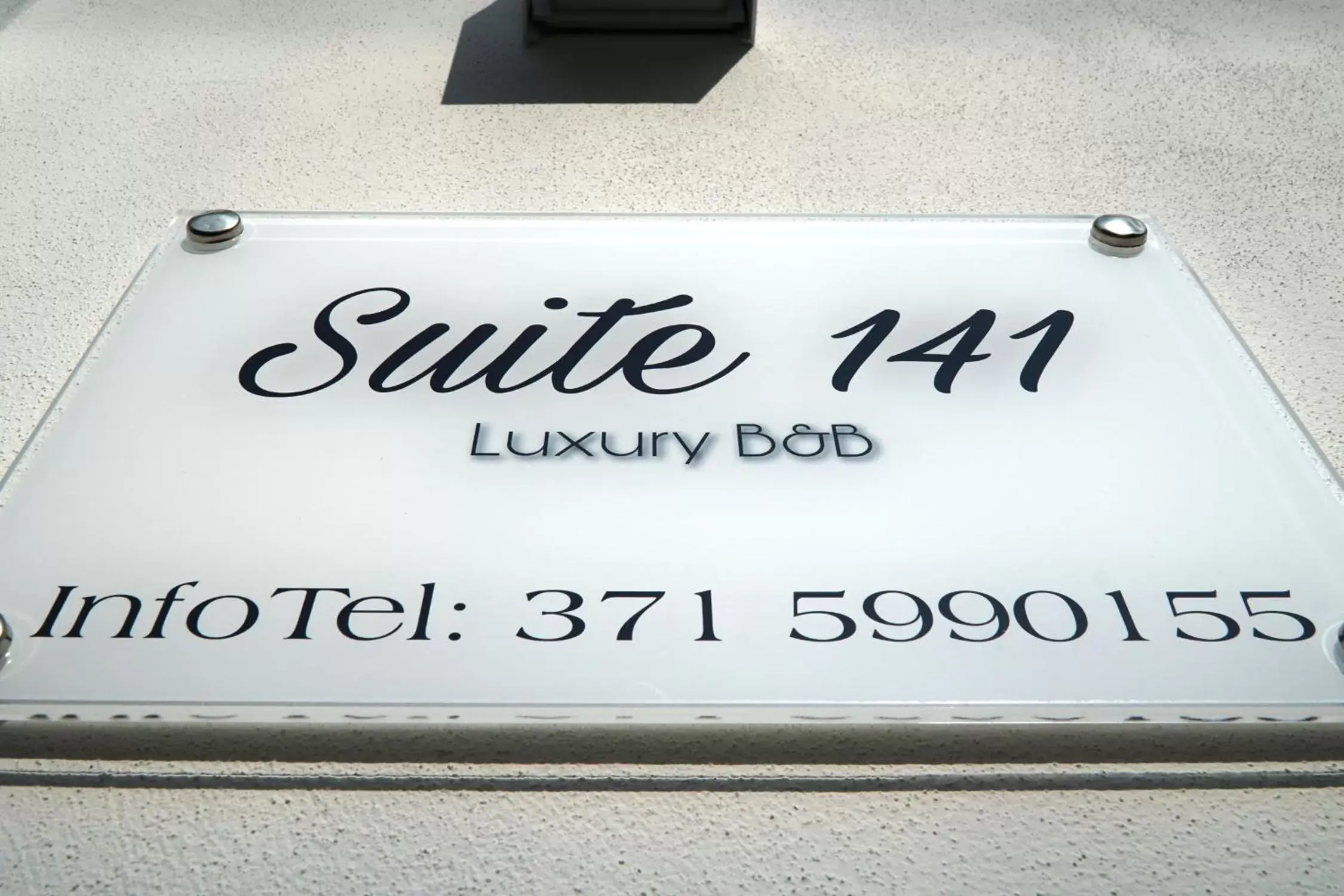 Property Logo/Sign in Suite 141 - Luxury B&B