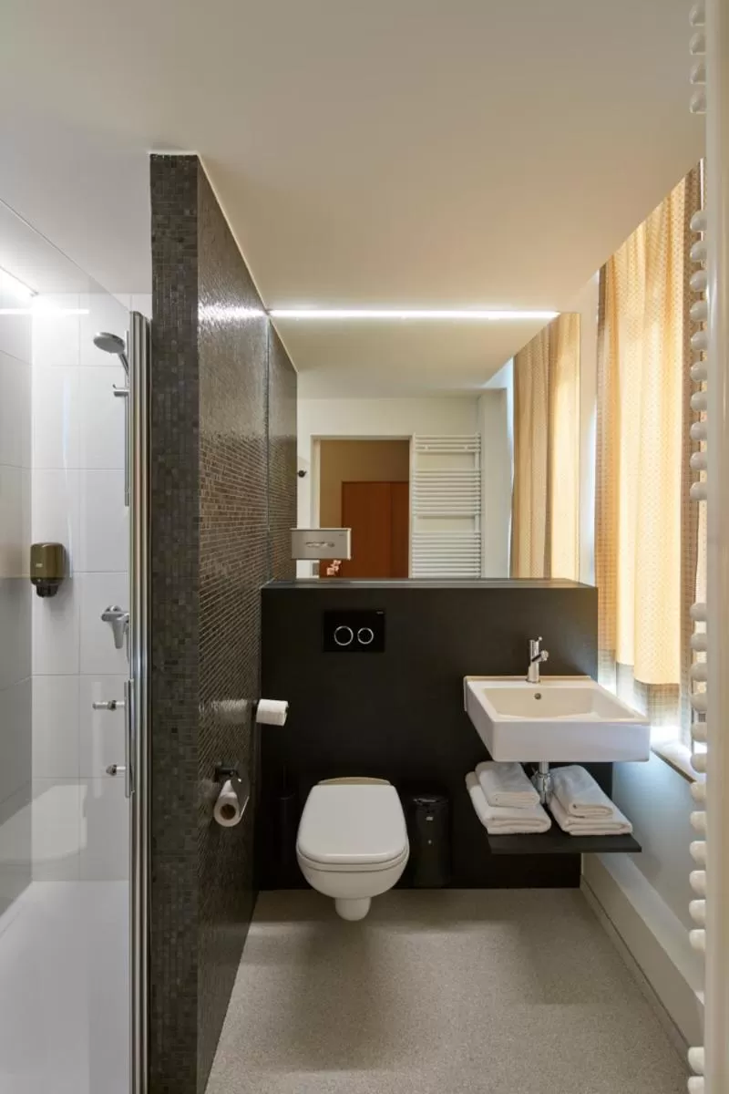 Bathroom in Alpha Hotel and Aparthotel
