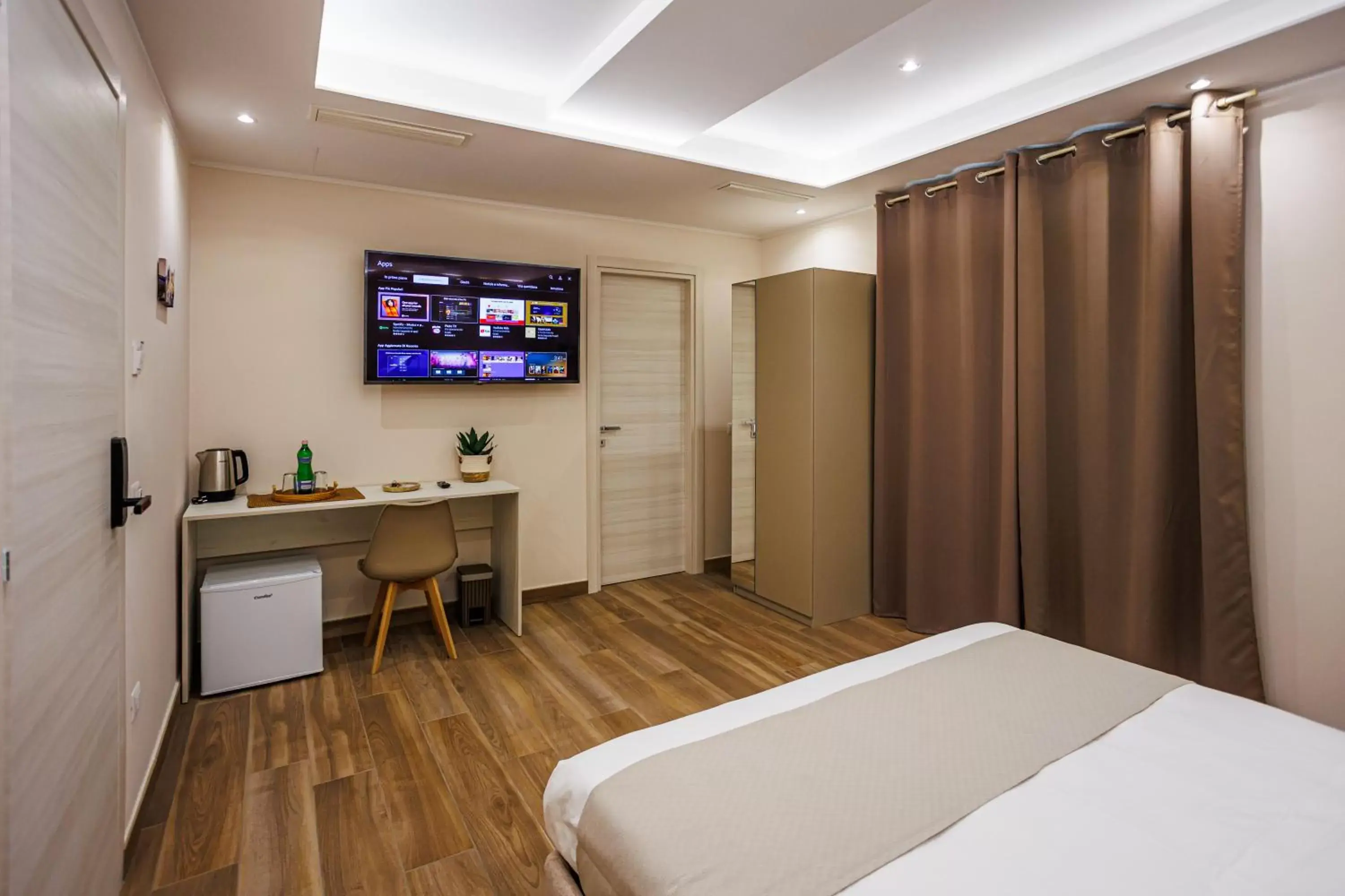 Bed, TV/Entertainment Center in Peca's room