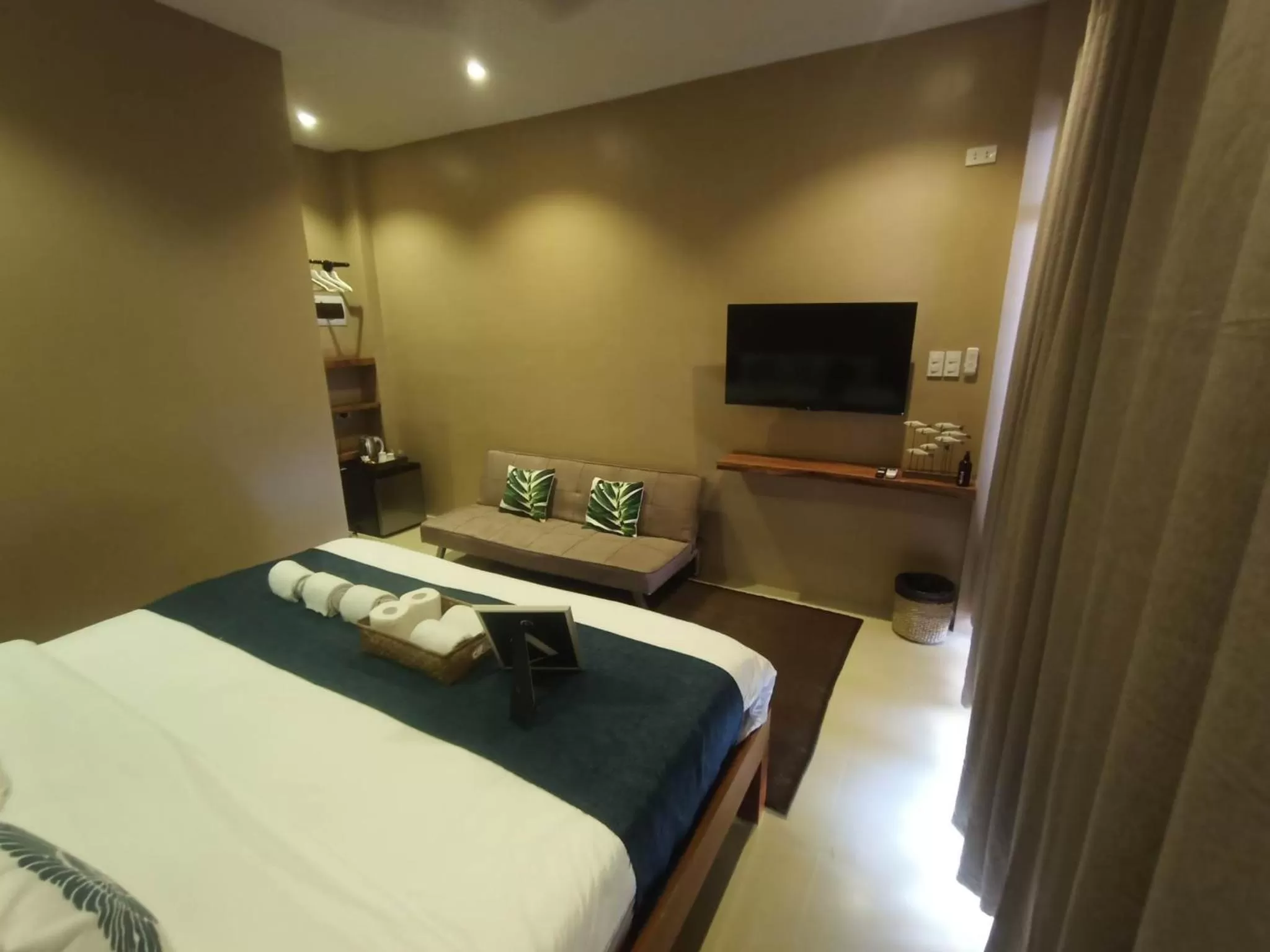 Bed in Southseas Beach Resort and Dive Center