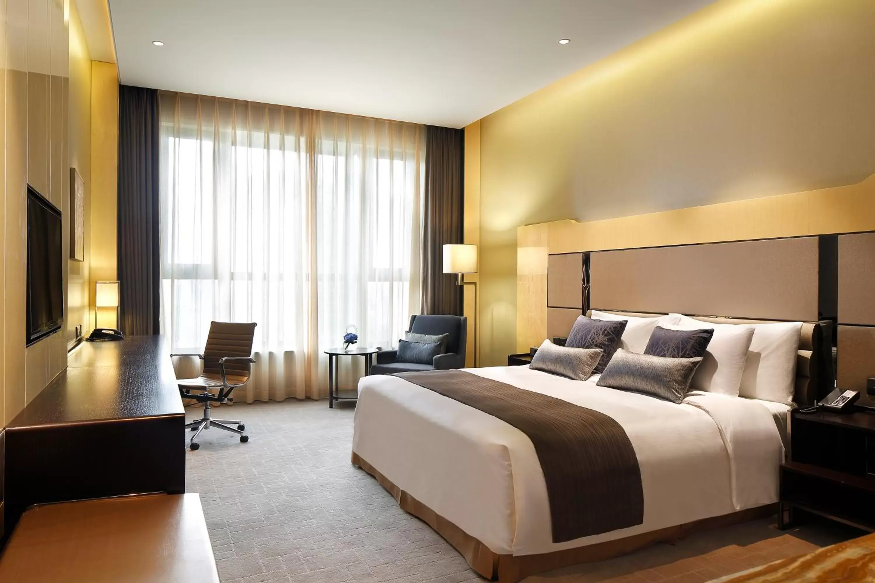 Bed in Crowne Plaza Beijing Lido, an IHG Hotel