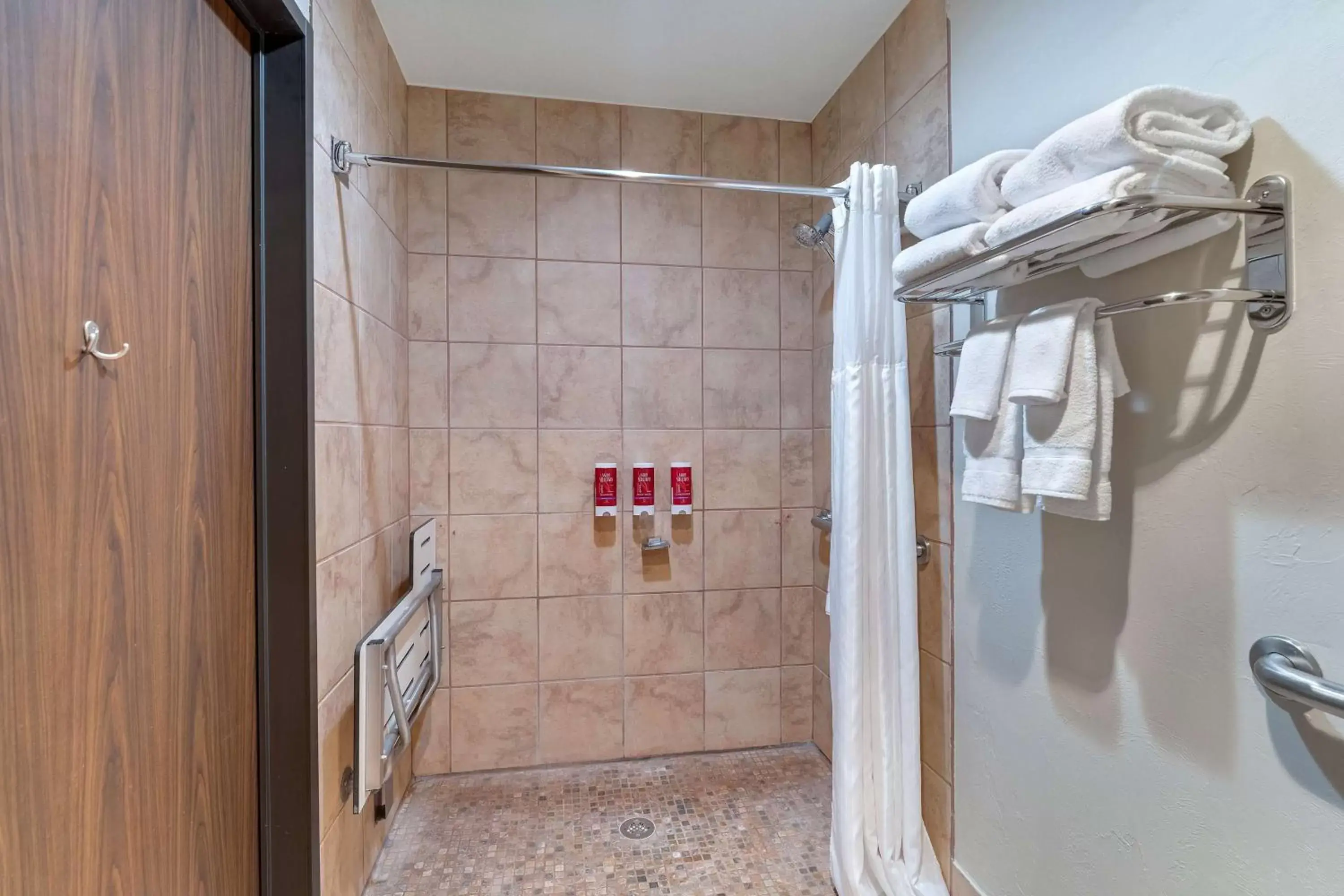 Bathroom in SureStay Plus Hotel by Best Western Price