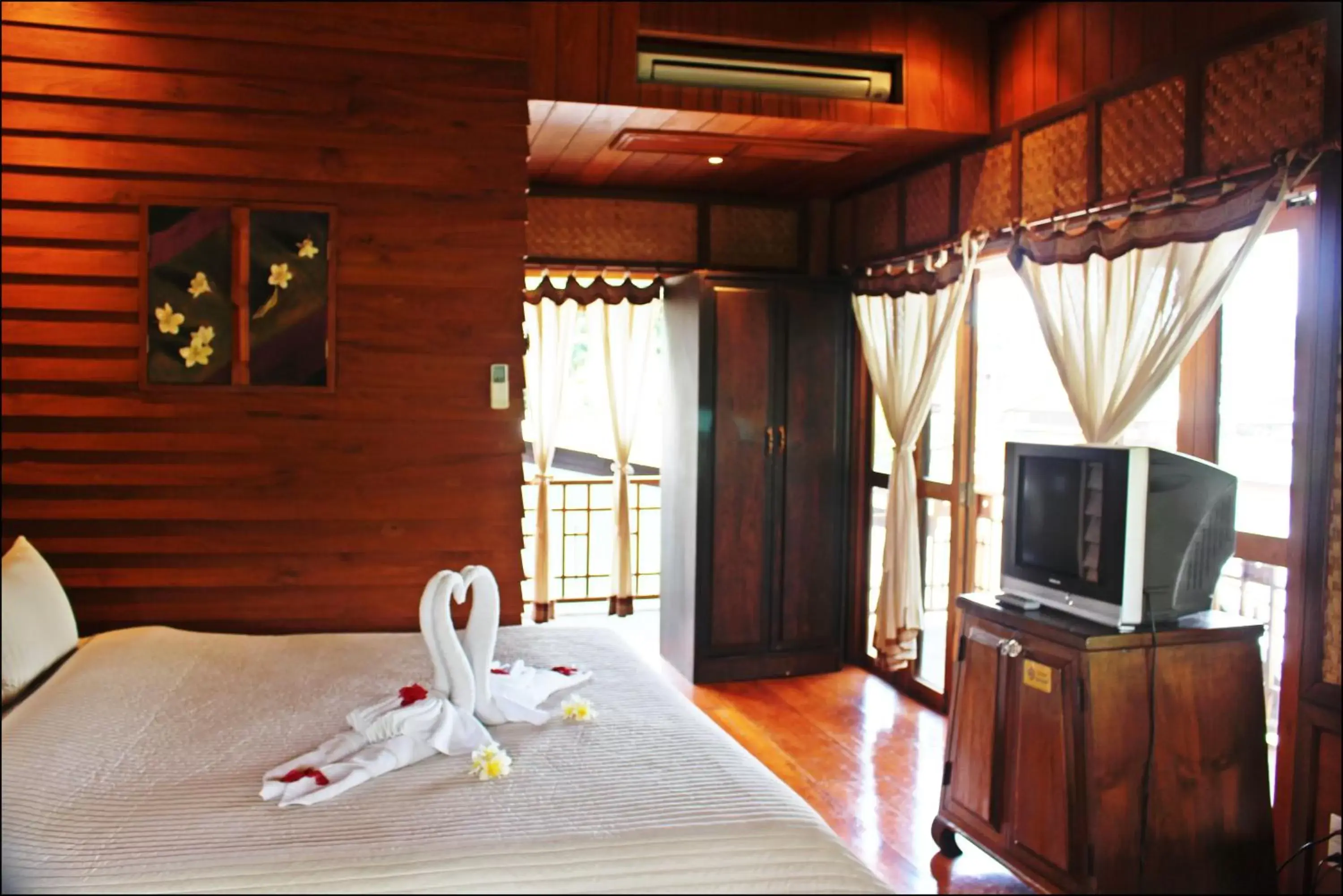 Photo of the whole room, TV/Entertainment Center in Pai Vimaan Resort