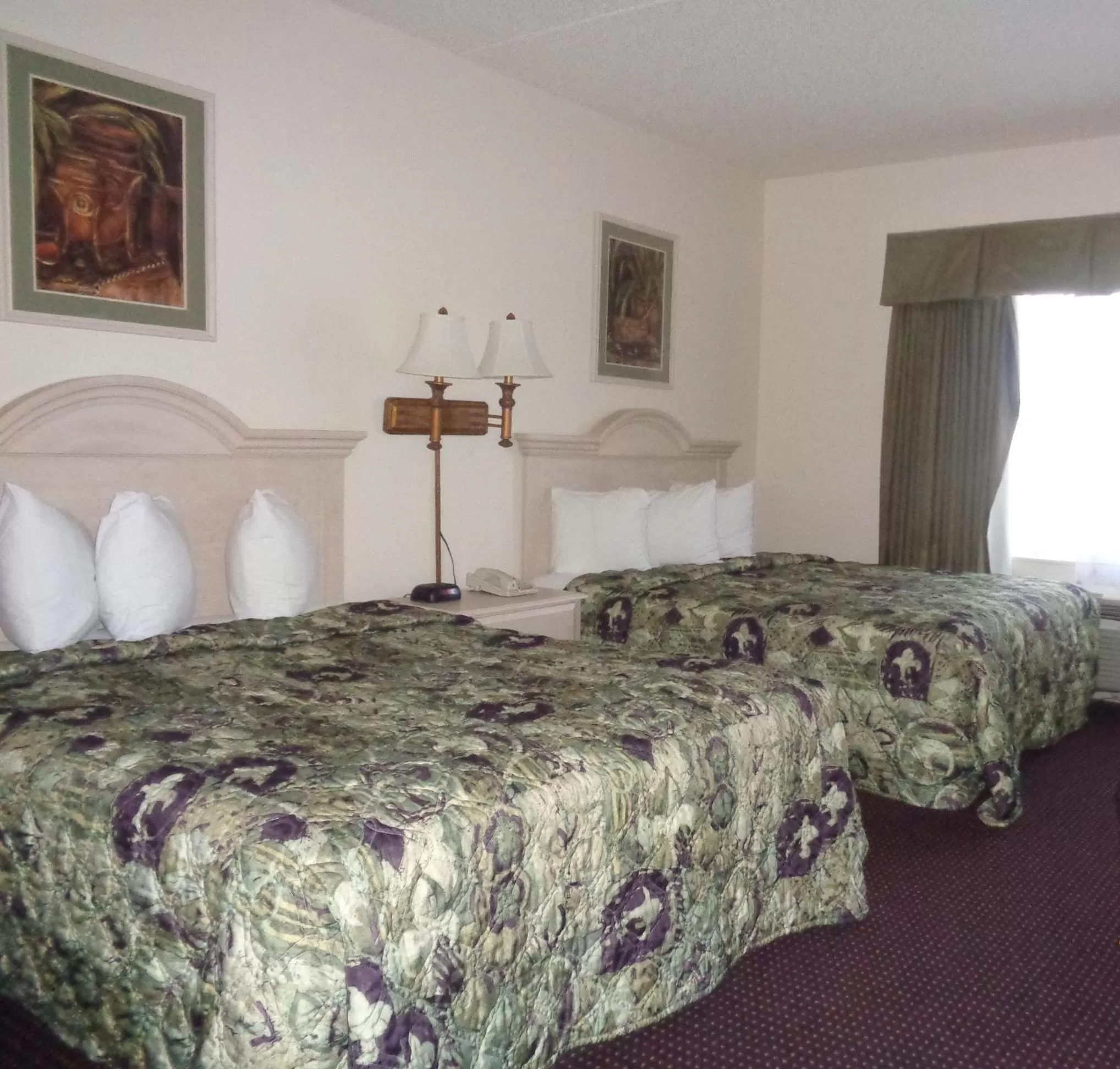 Bed in Allure Suites of Fort Myers