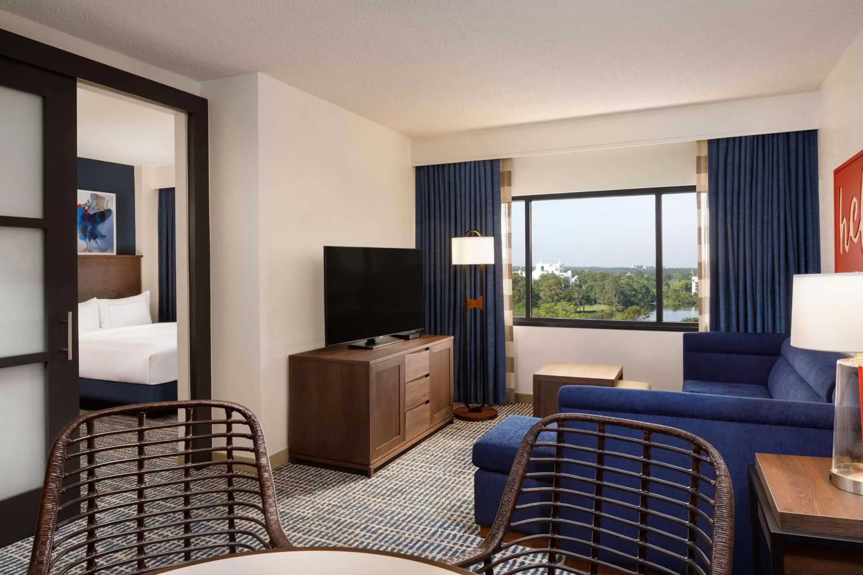 Bedroom, TV/Entertainment Center in DoubleTree Suites by Hilton Orlando at Disney Springs