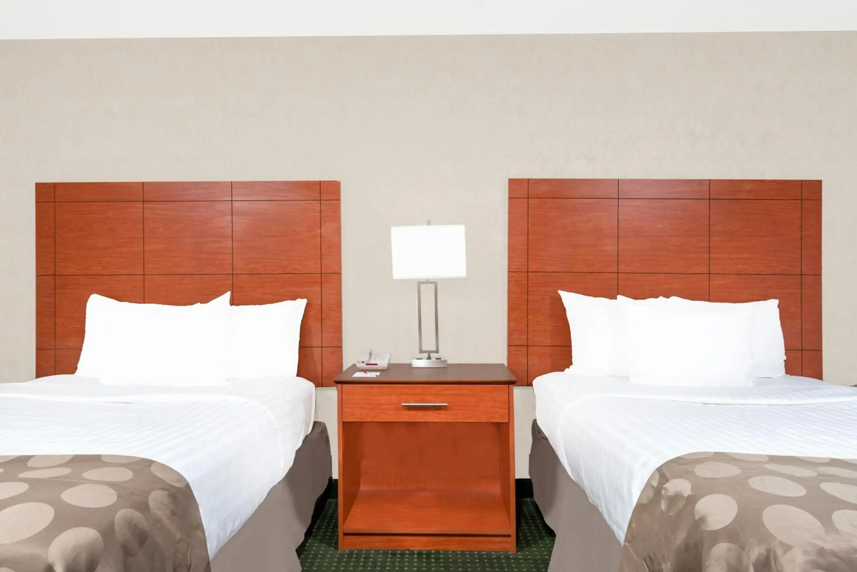 Bed in Ramada by Wyndham Lexington North Hotel & Conference Center