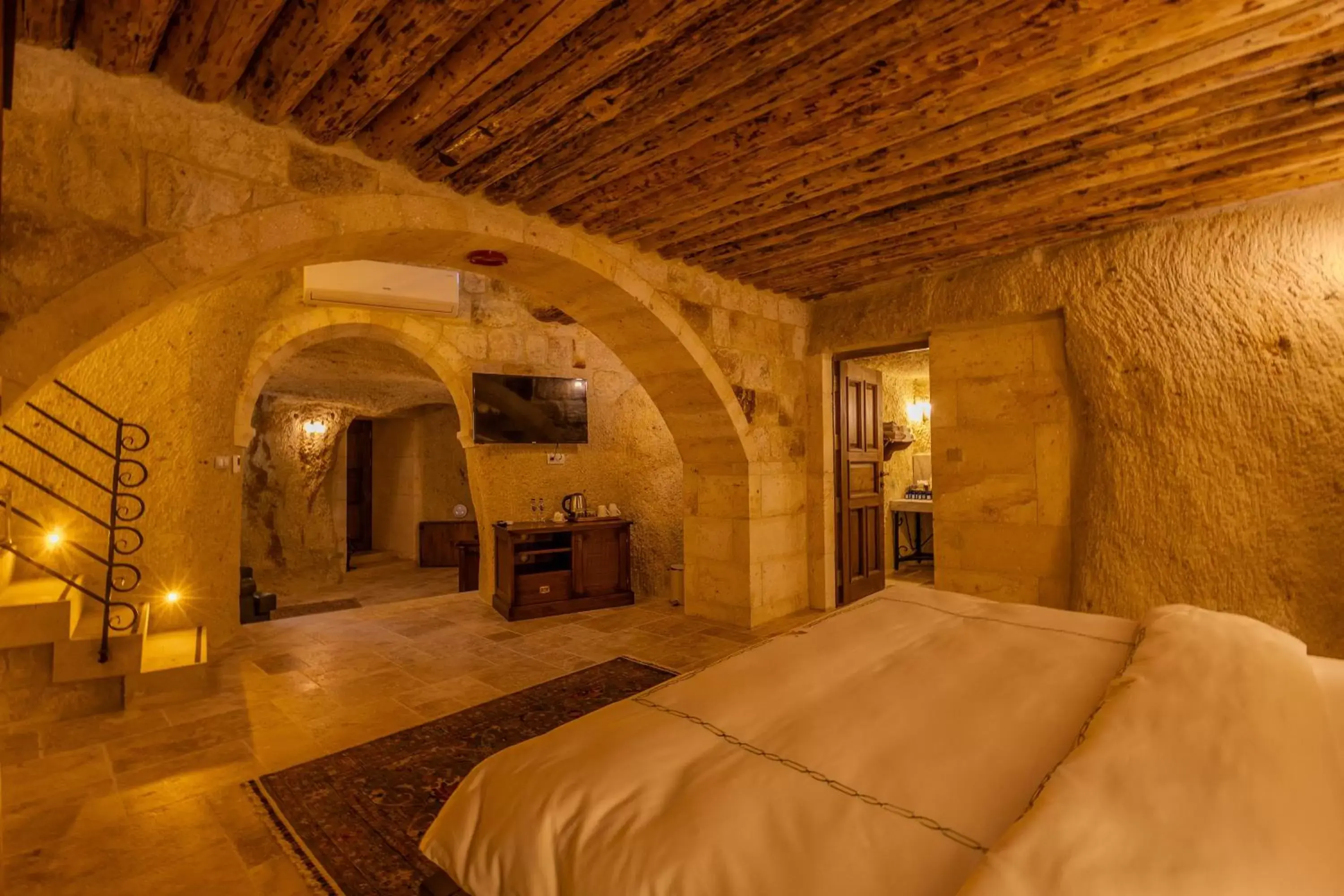 Bed in Seraphim Cave Suites & SPA