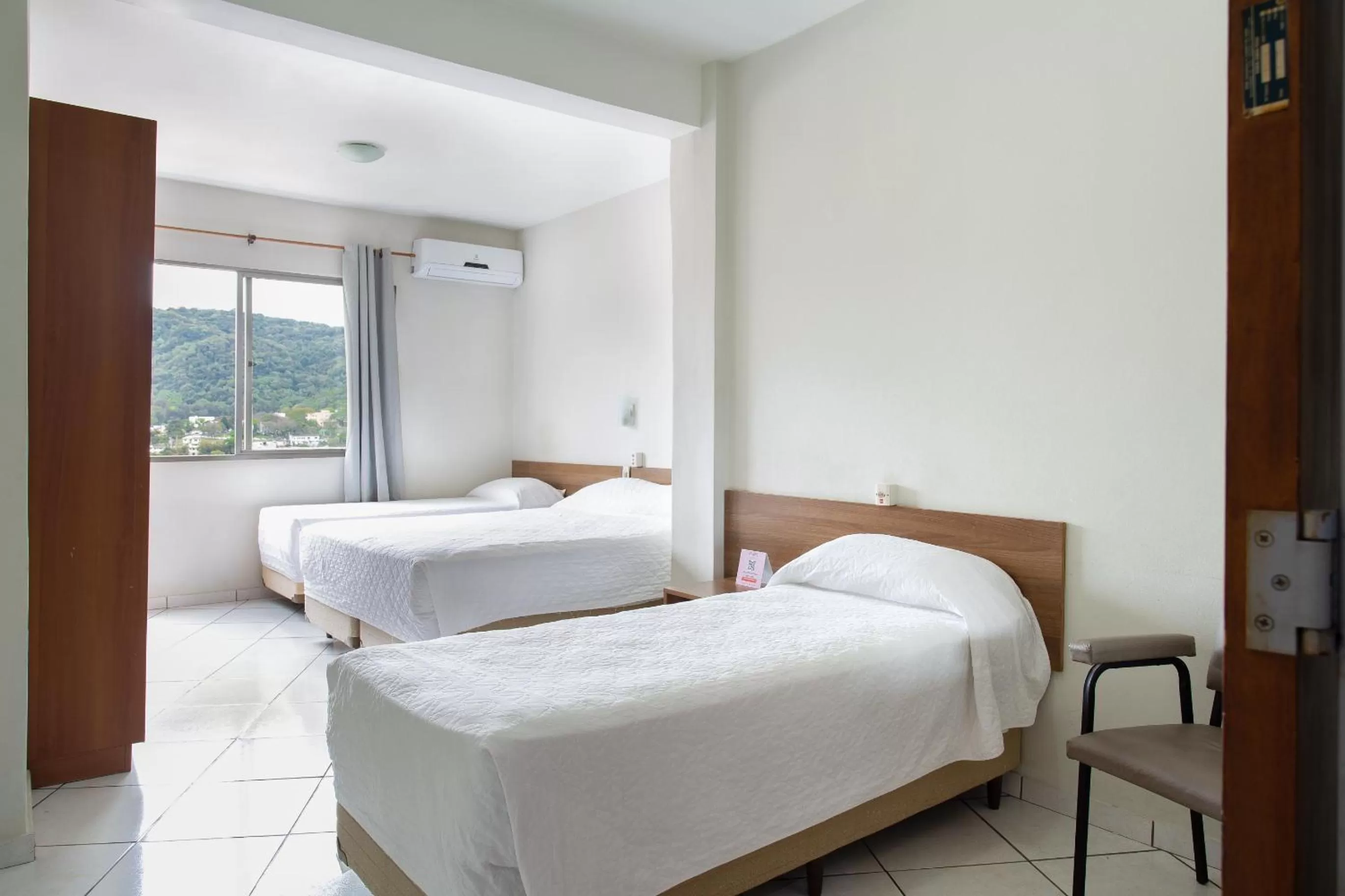 Bed in Hotel Dom Rafael Express