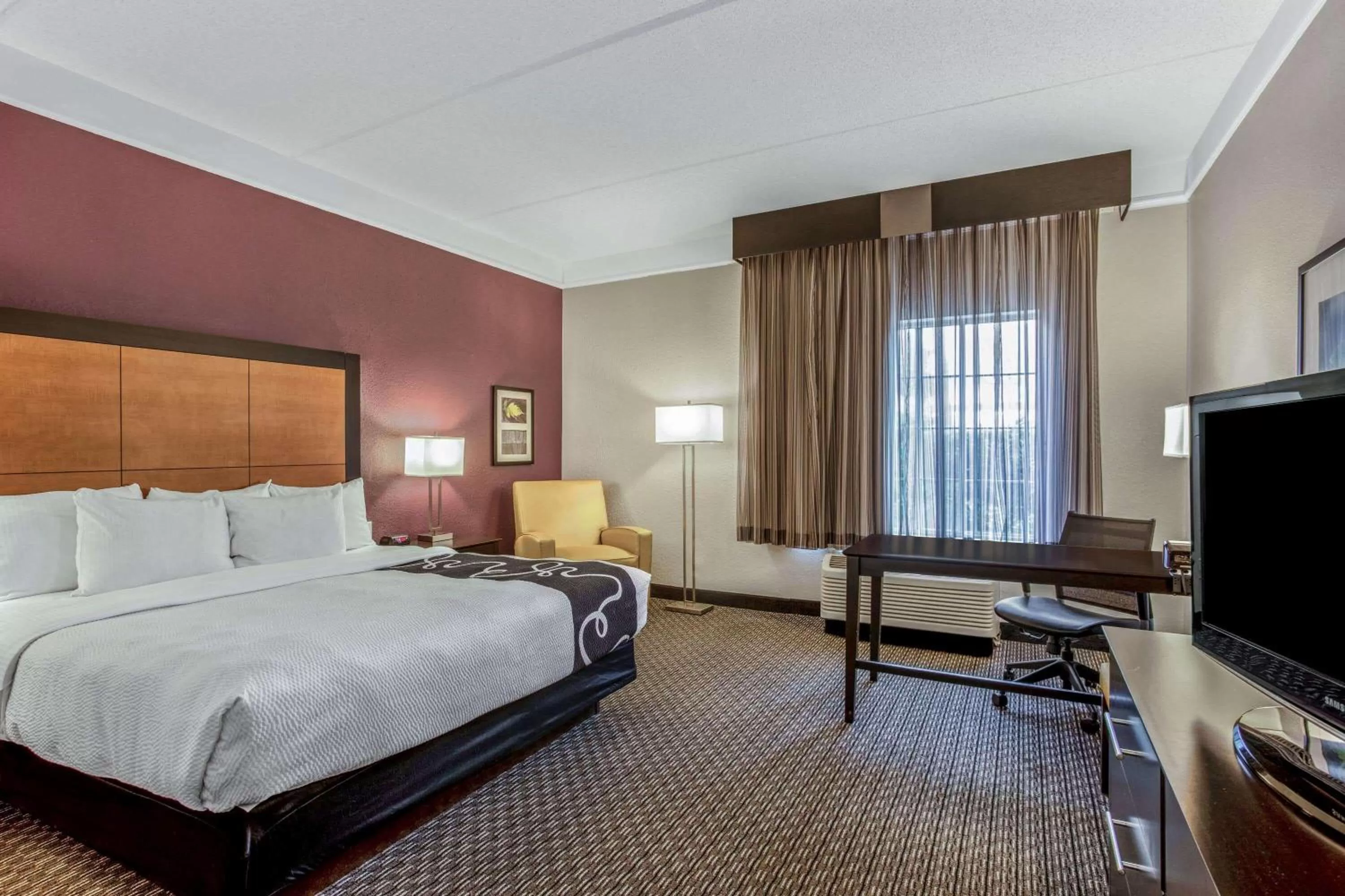 Photo of the whole room, Bed in La Quinta by Wyndham Orlando Airport North - Free Airport Shuttle!