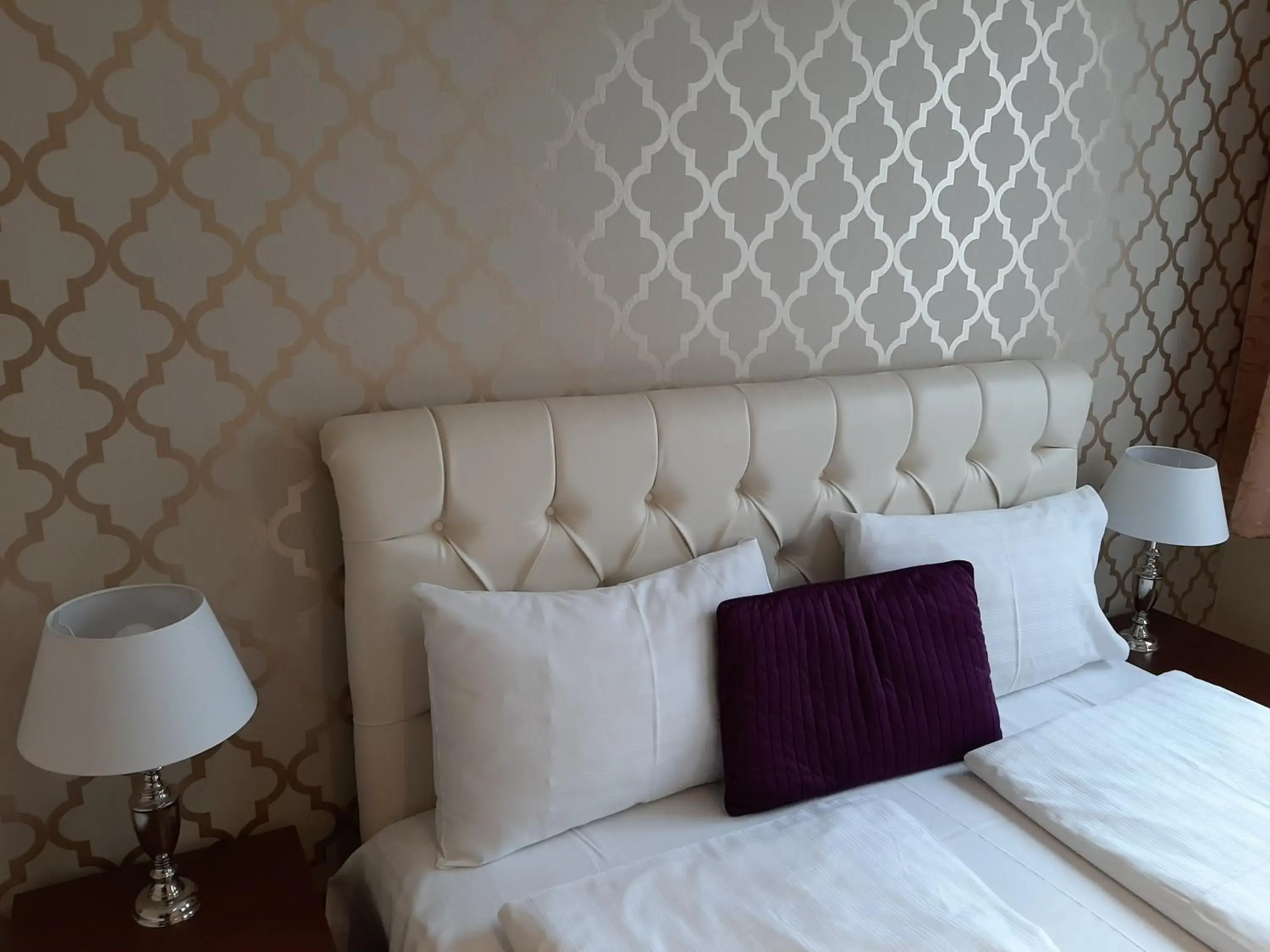 Bed in Trendy Deluxe Apartments Bed in Trendy Deluxe Apartments