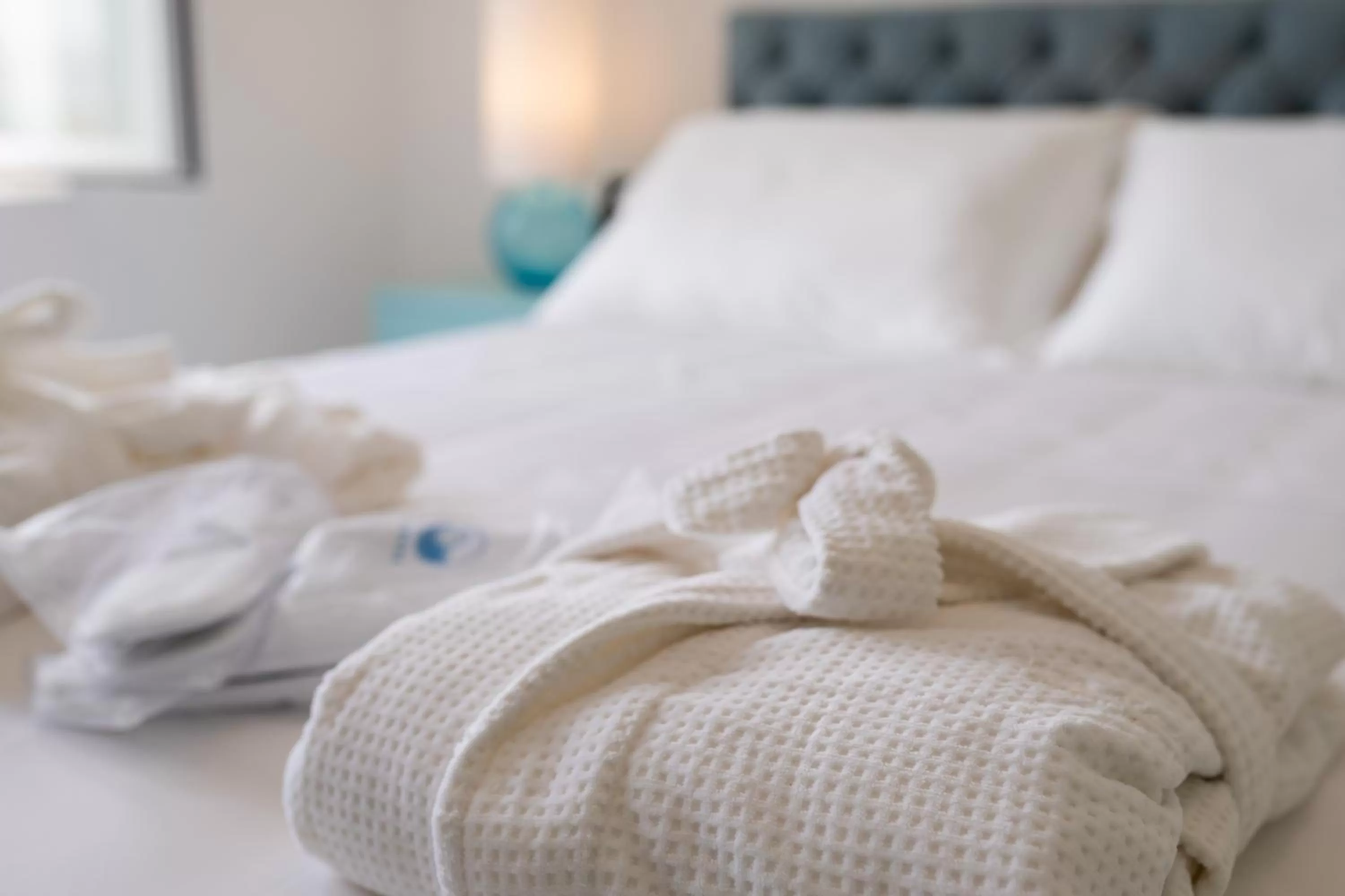 Bed in Grotta Palazzese Beach Hotel