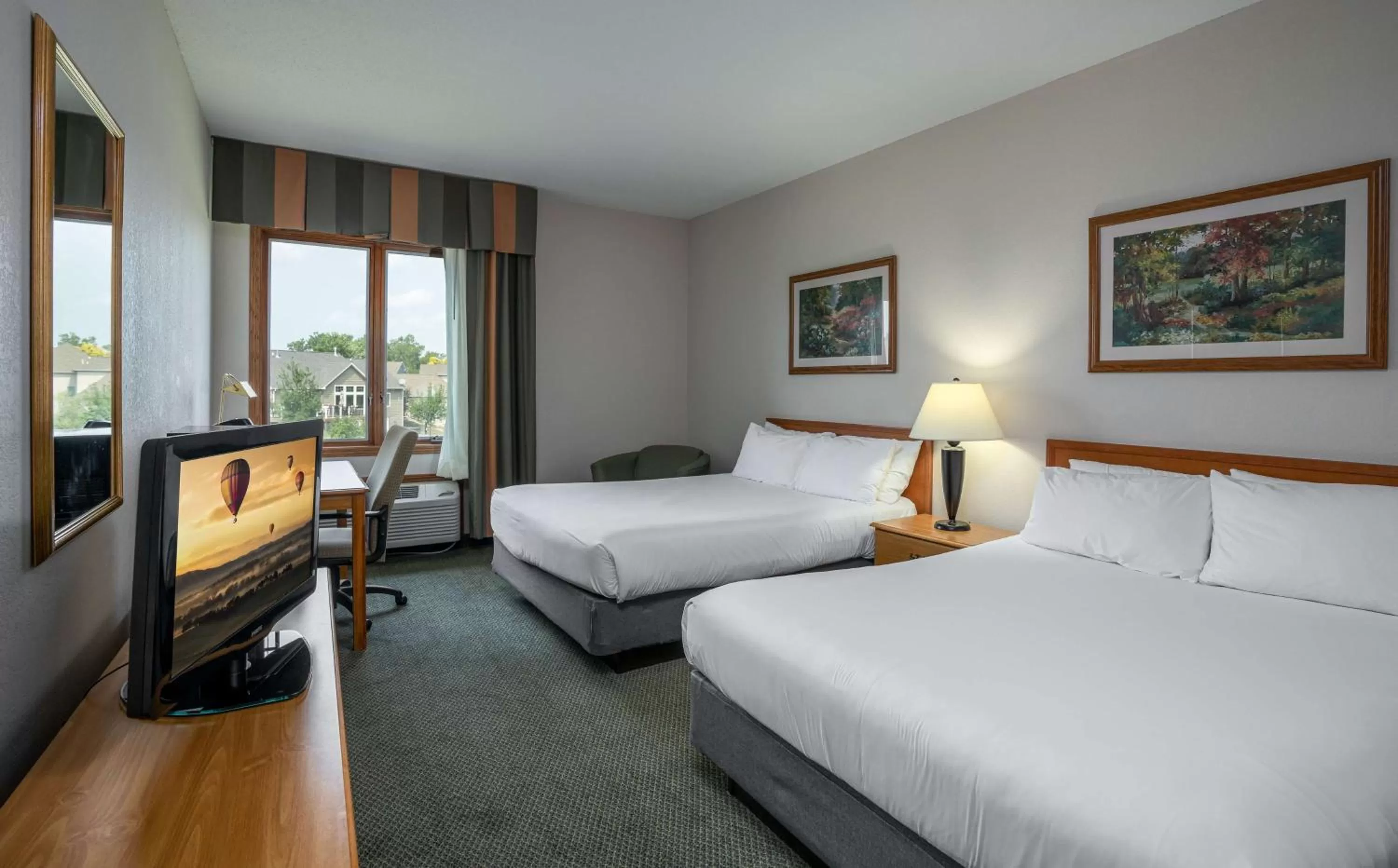 Queen Room with Two Queen Beds in GrandStay Hotel & Suites Pella