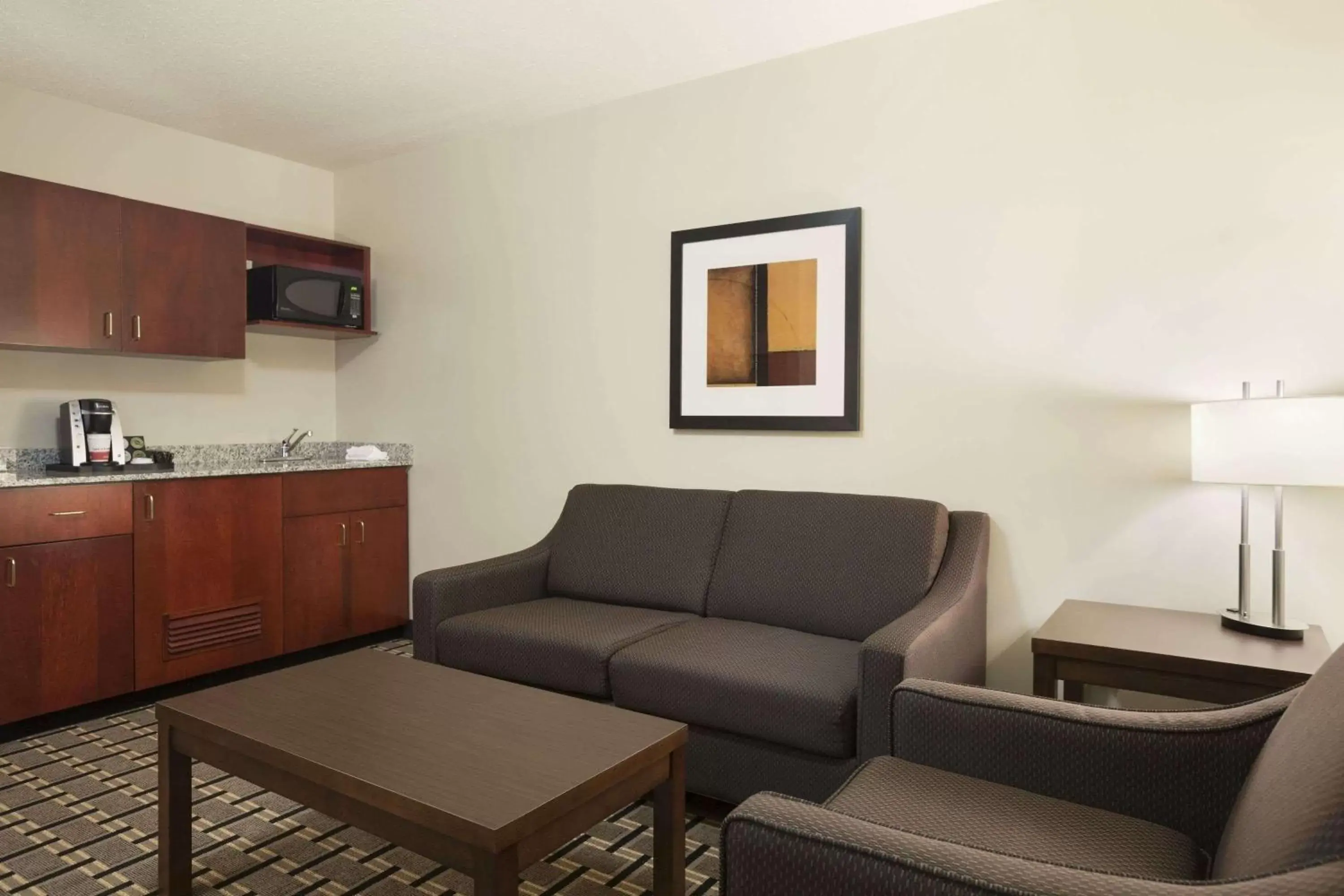 Photo of the whole room, Seating Area in Ramada by Wyndham Edson