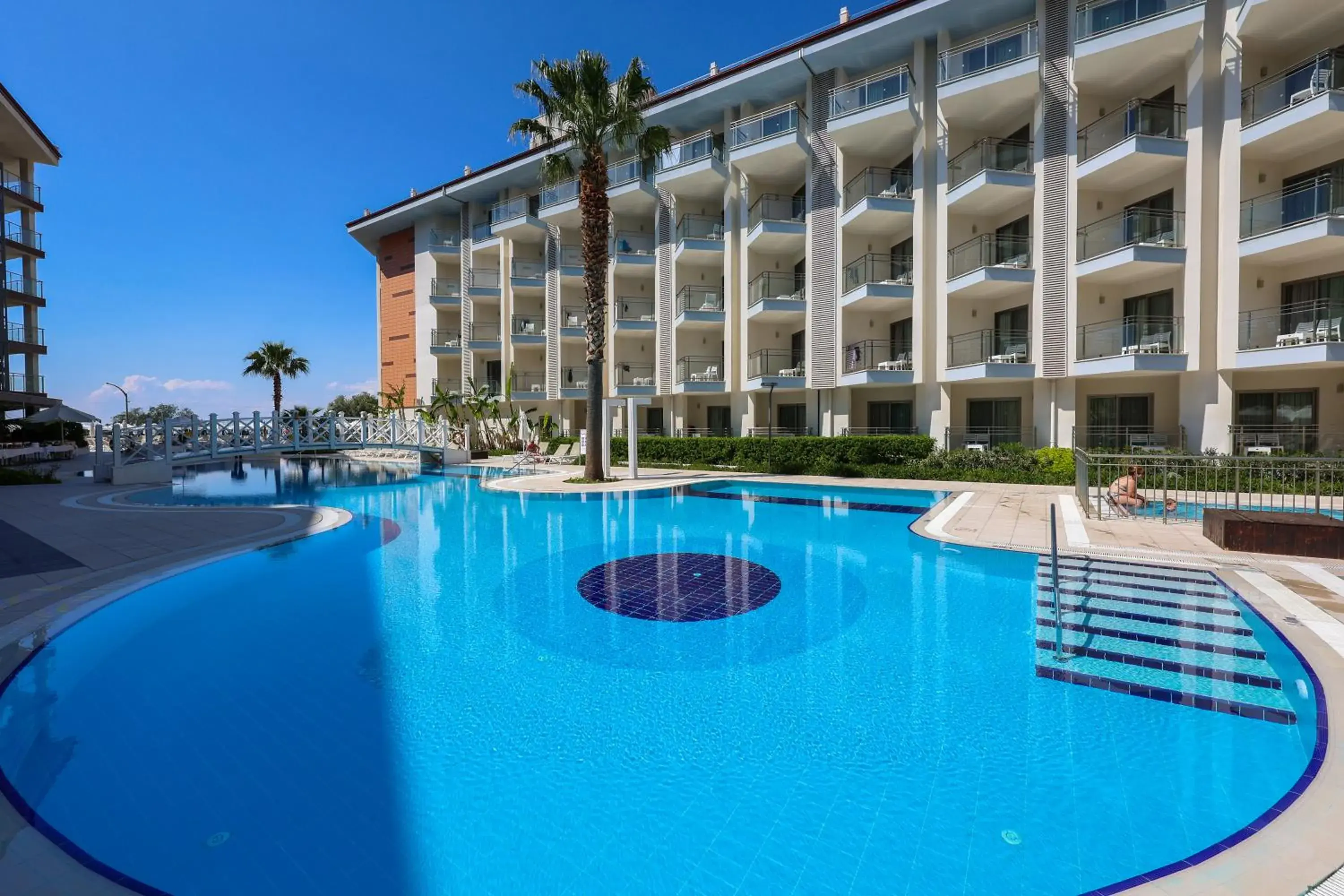 Swimming pool, Property Building in Ramada Hotel & Suites by Wyndham Kusadasi