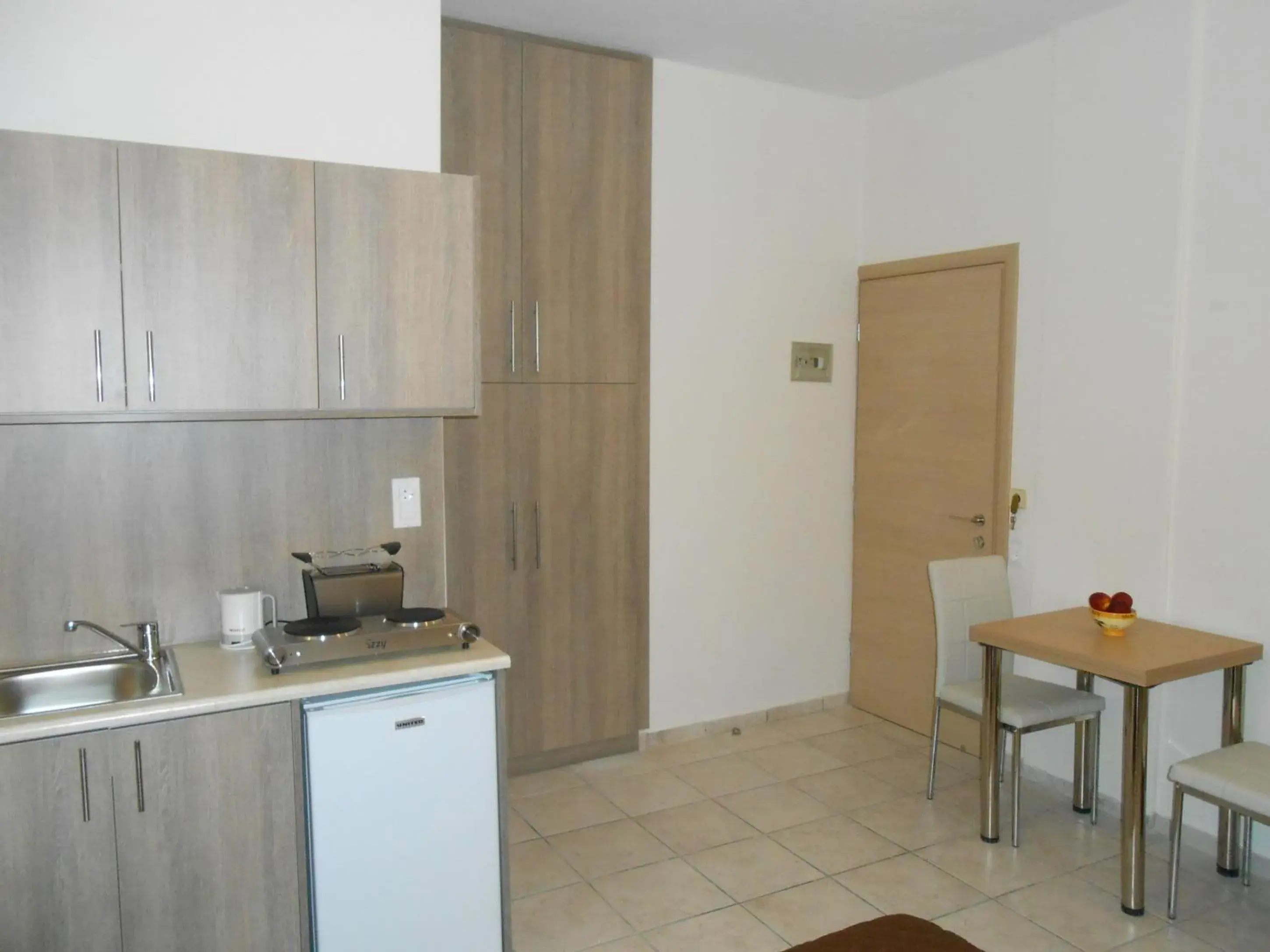 Kitchen or kitchenette, Kitchen/Kitchenette in Voula Hotel