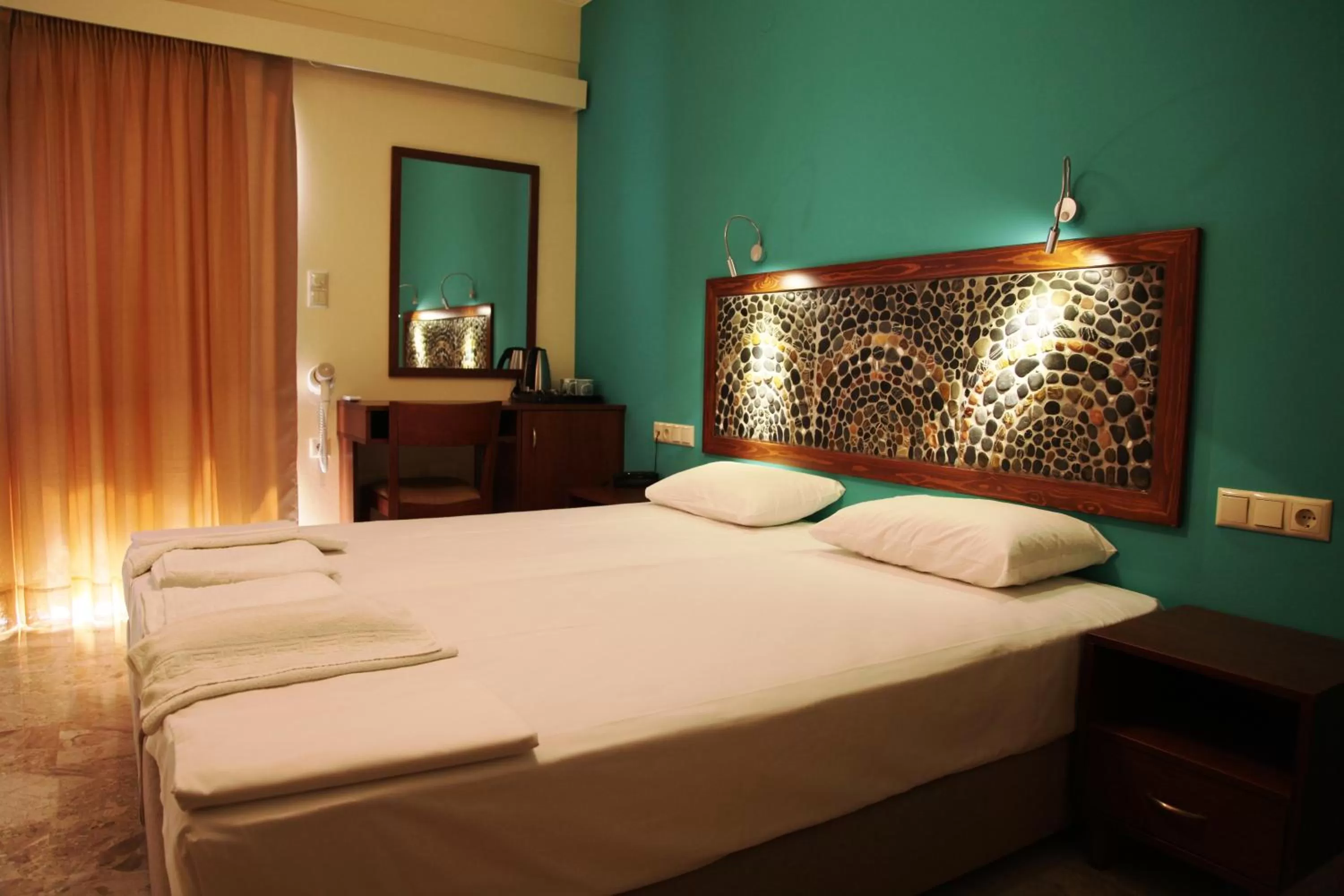 Bed in Aris Boutique Hotel