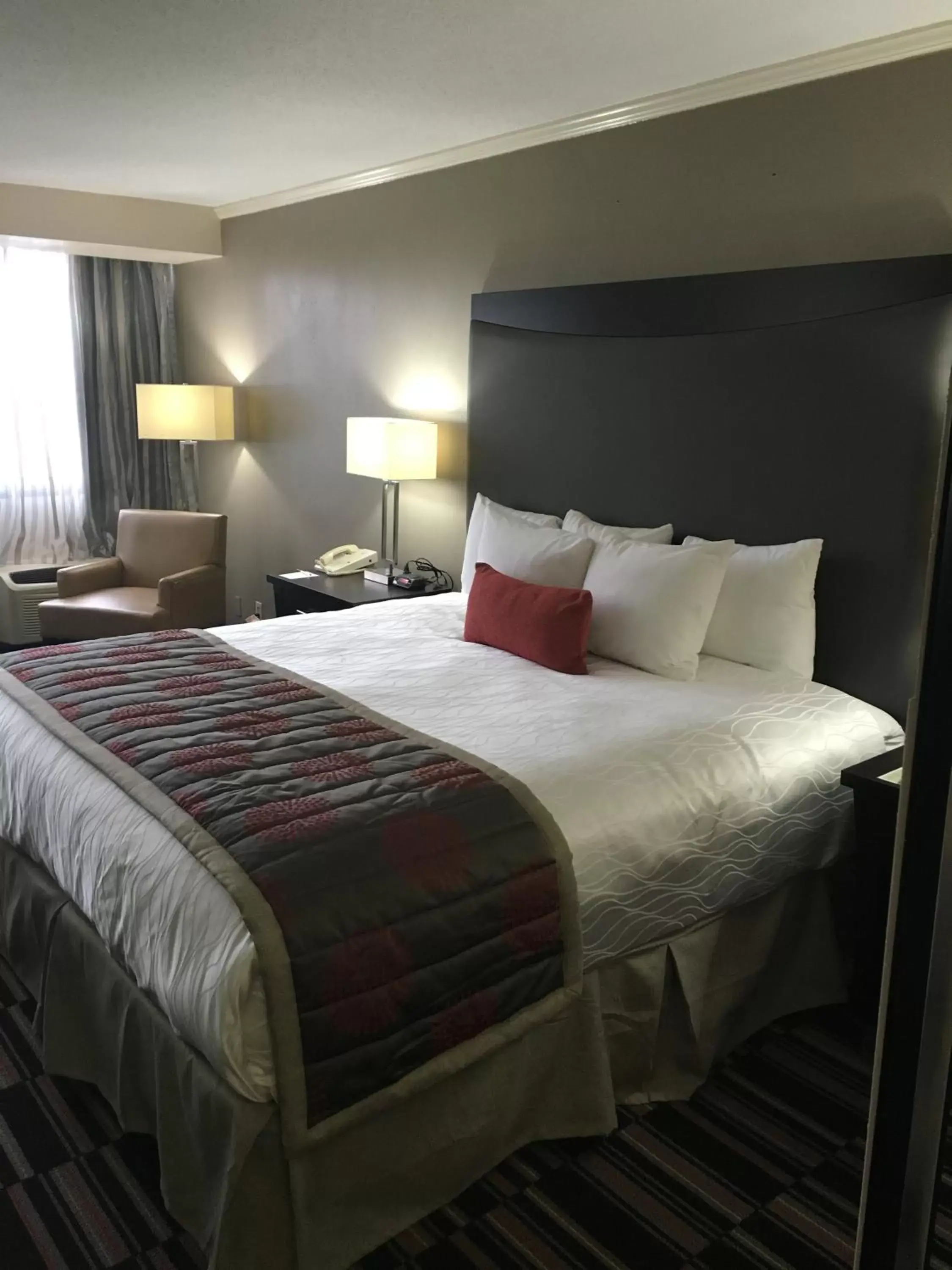 Bed in Ramada Plaza by Wyndham Charlotte South End Airport