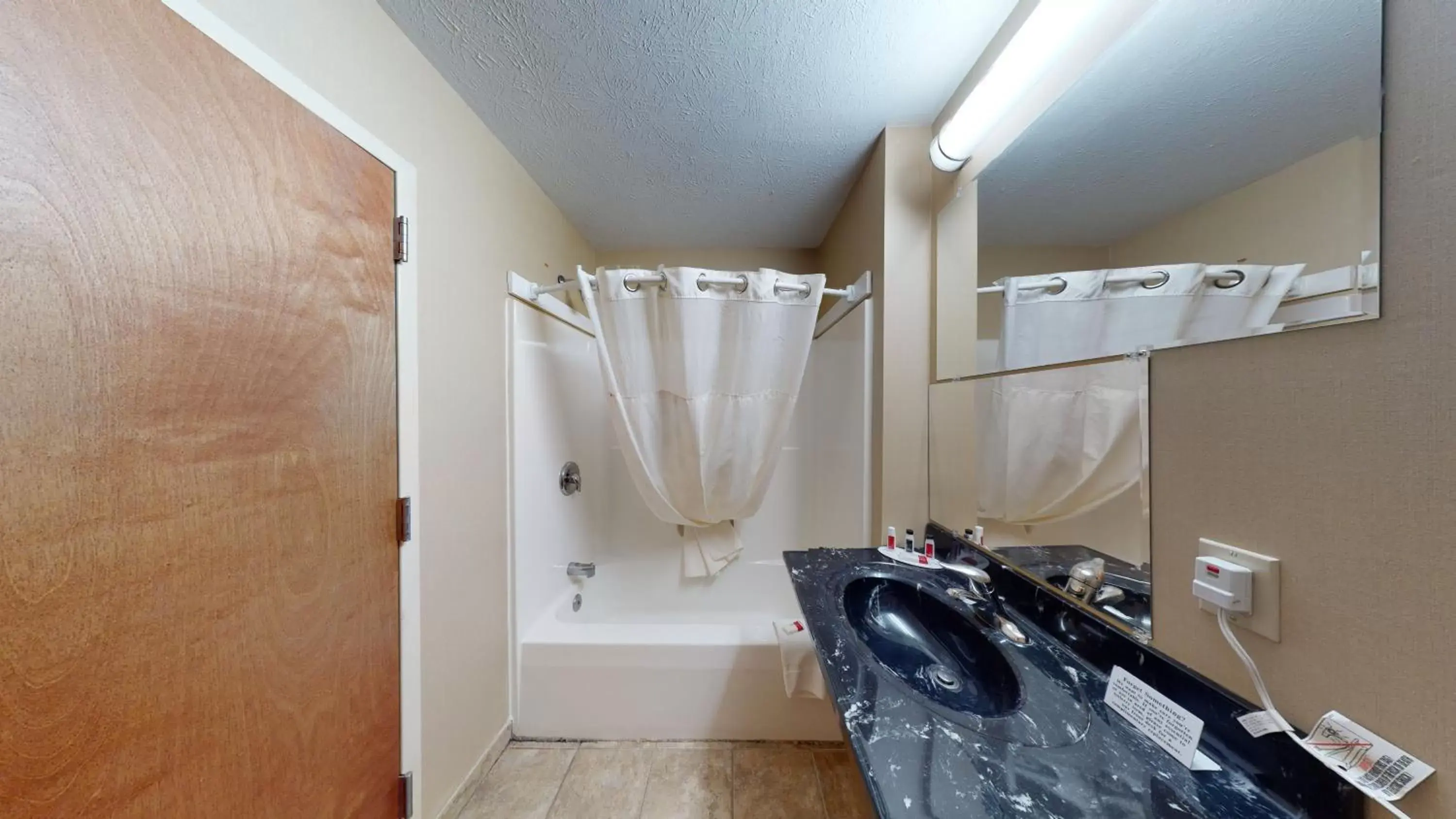Bathroom in Ramada by Wyndham Strasburg - Shenandoah Valley
