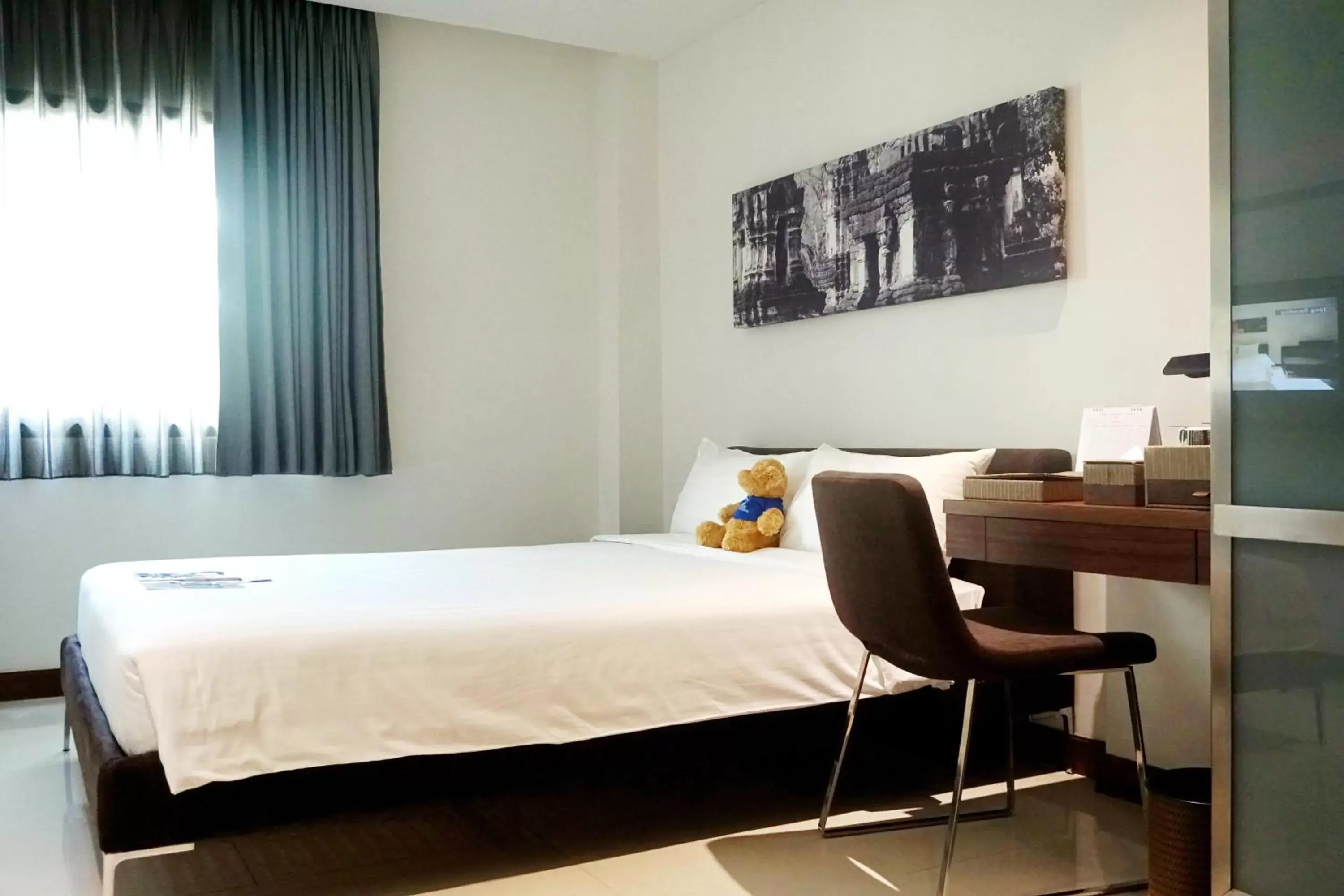 Bed in S33 Compact Sukhumvit Hotel