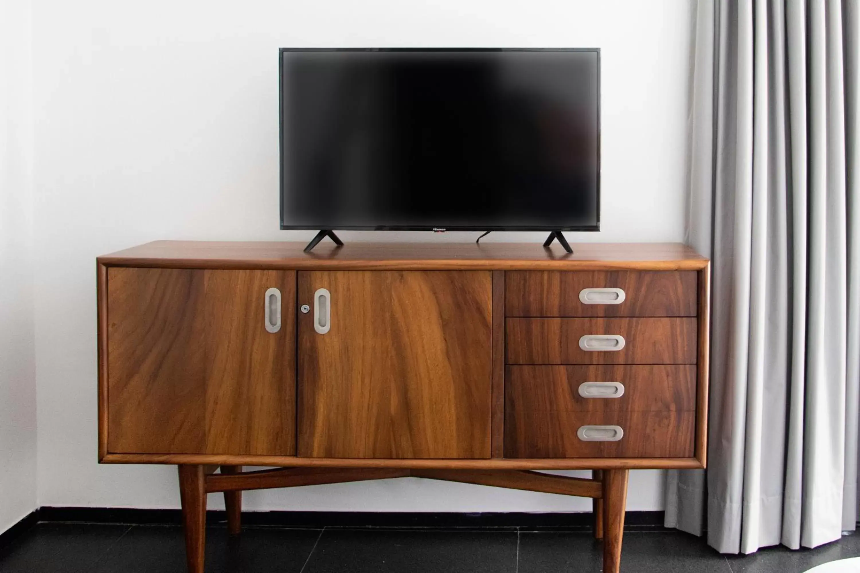 Bedroom, TV/Entertainment Center in Sole Suites