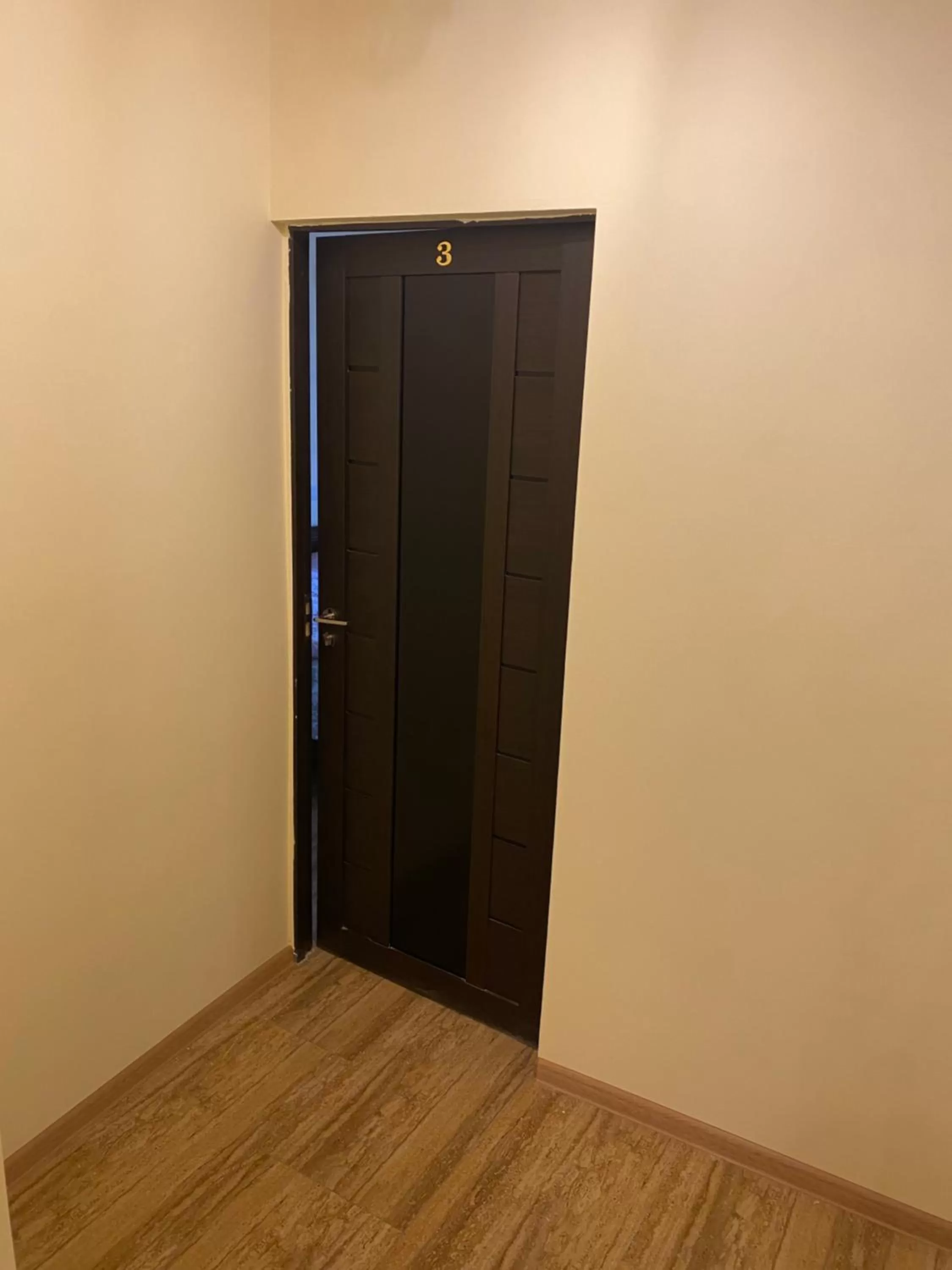 Property building, TV/Entertainment Center in Karine B&B