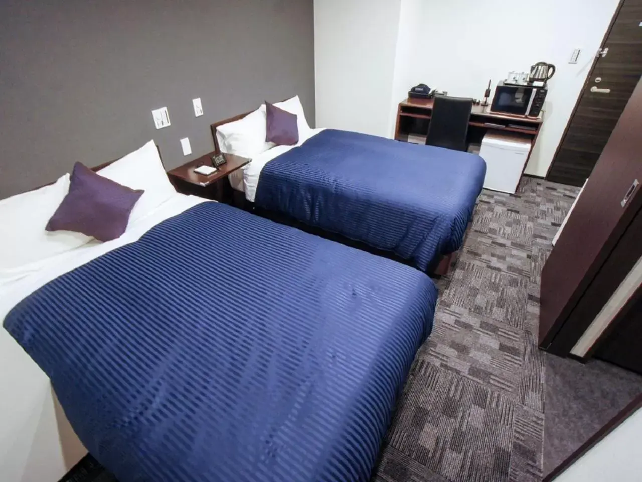 Bed in HOTEL LiVEMAX Nagoya Sakae East