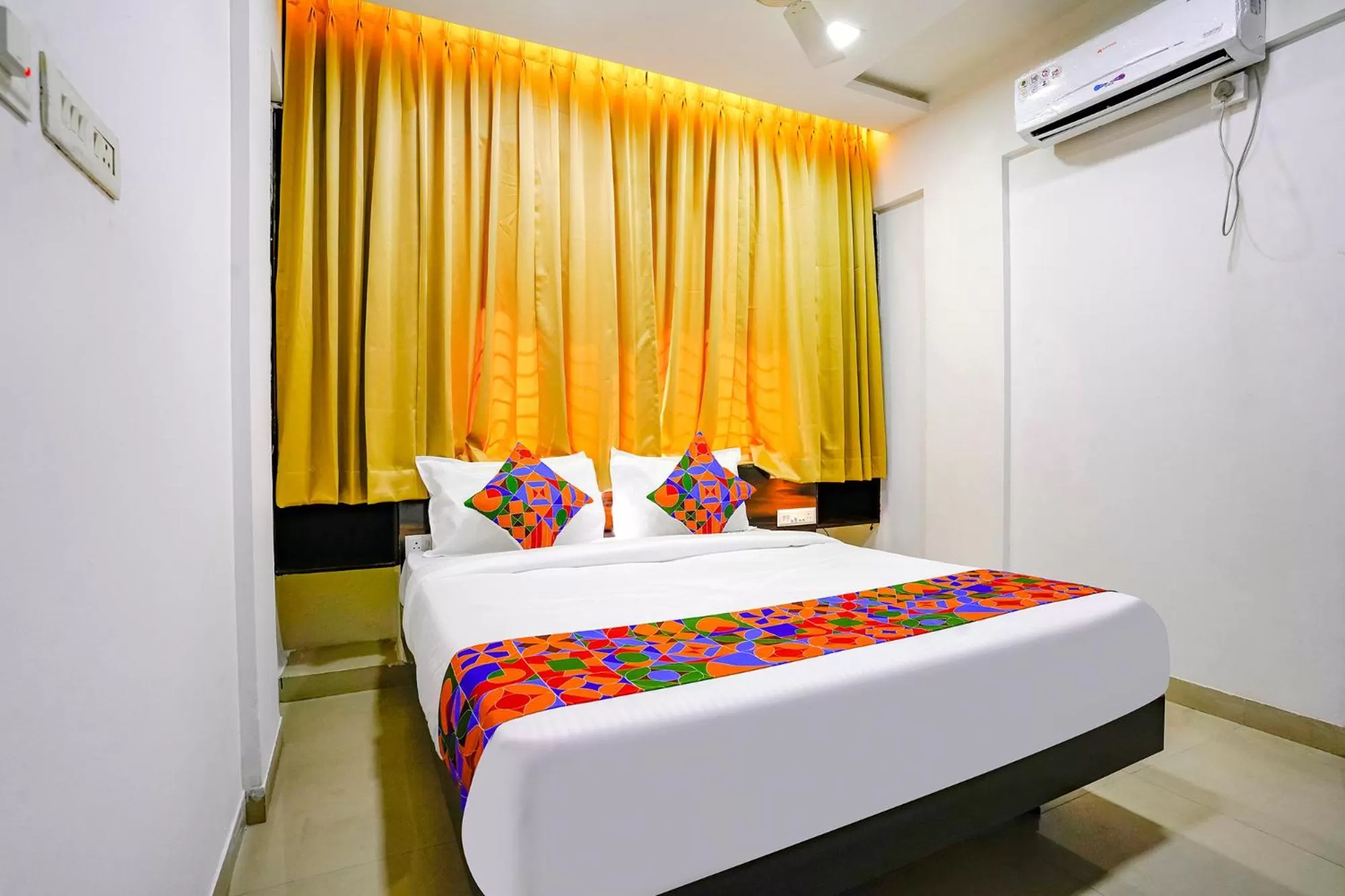 Bed in FabHotel Woods Regency