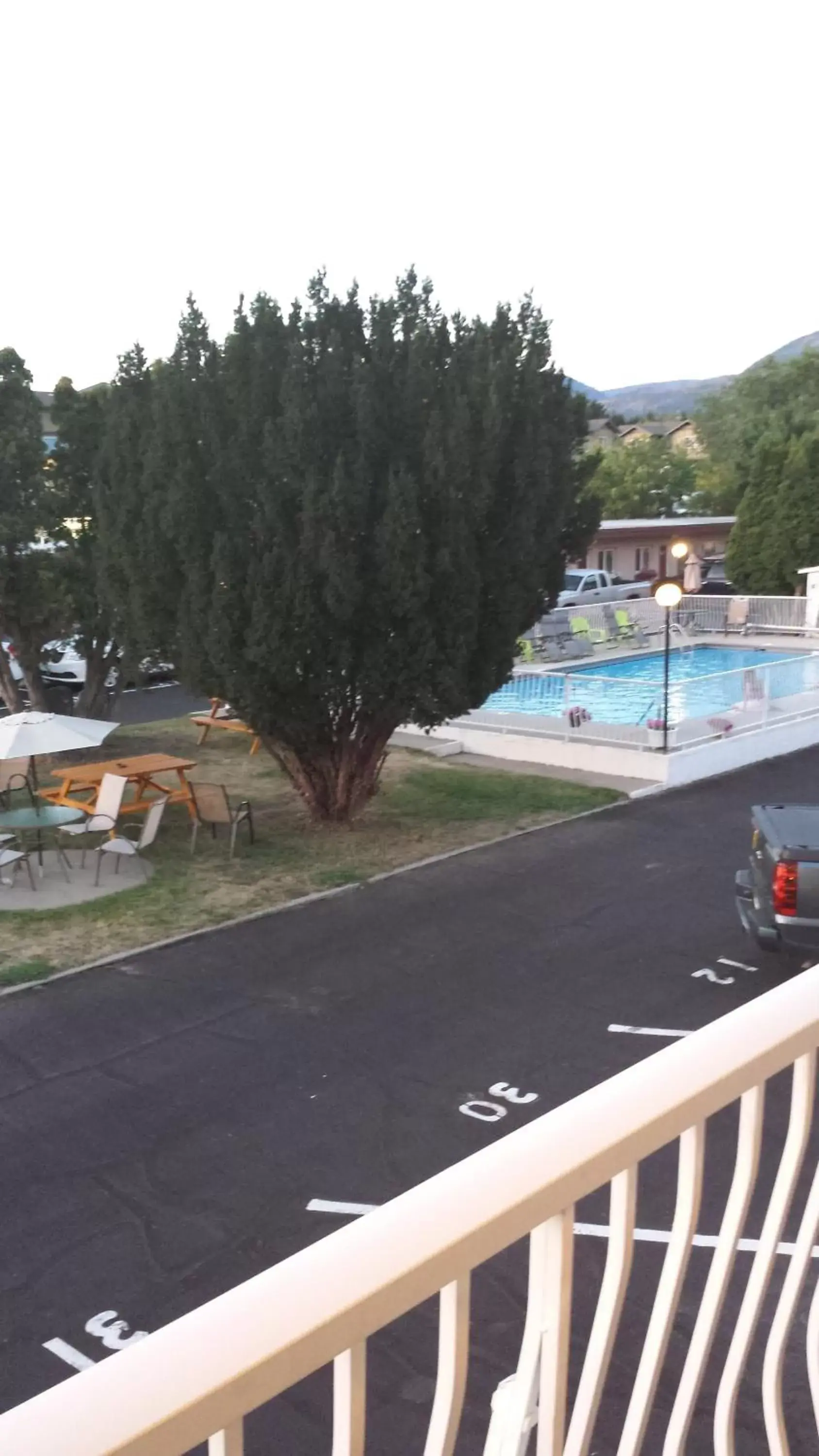 Balcony/Terrace, Swimming Pool in Swiss Sunset Inn