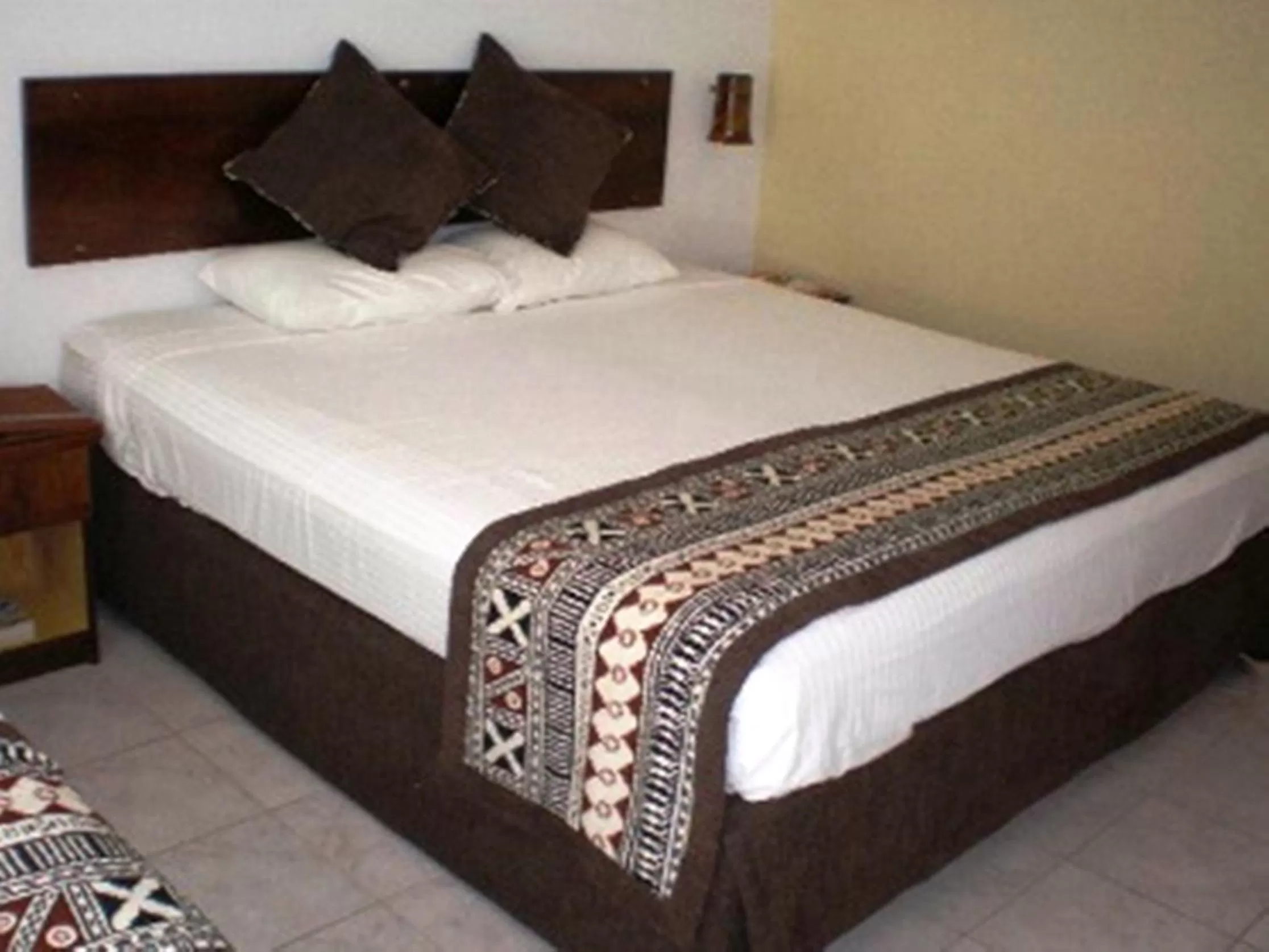 Bed in Capricorn International Hotel