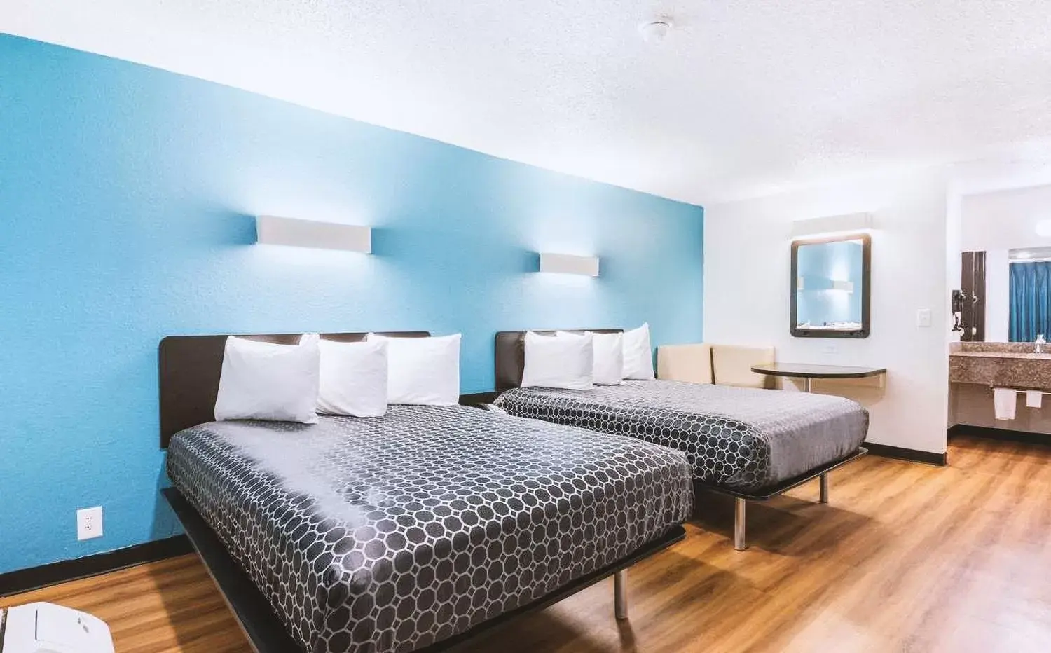 Bed in Sky Palace Inn & Suites By Jasper Beeville