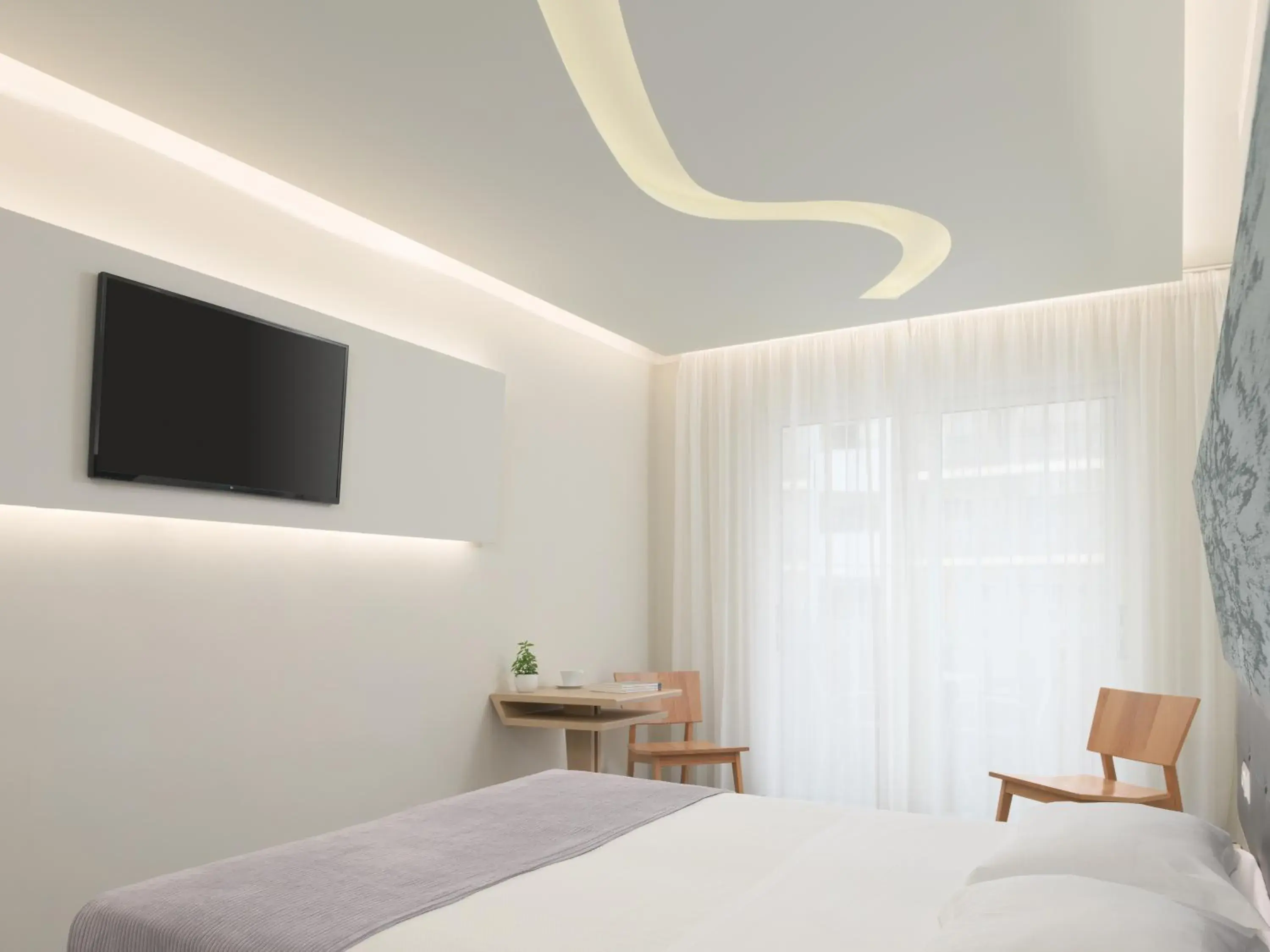 Bedroom, TV/Entertainment Center in Melrose Hotel Rethymno
