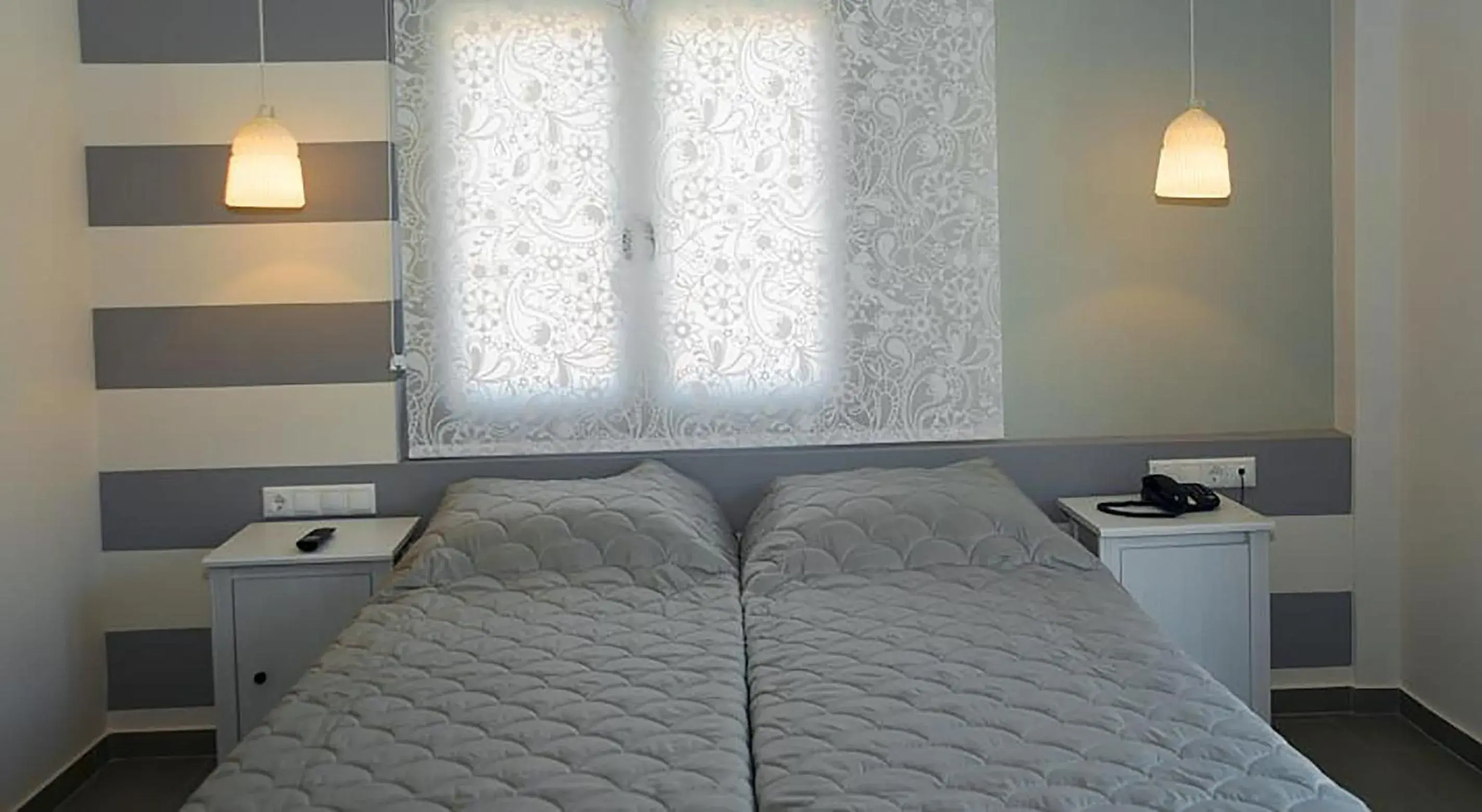 Bed in Dimitra Boutique Hotel