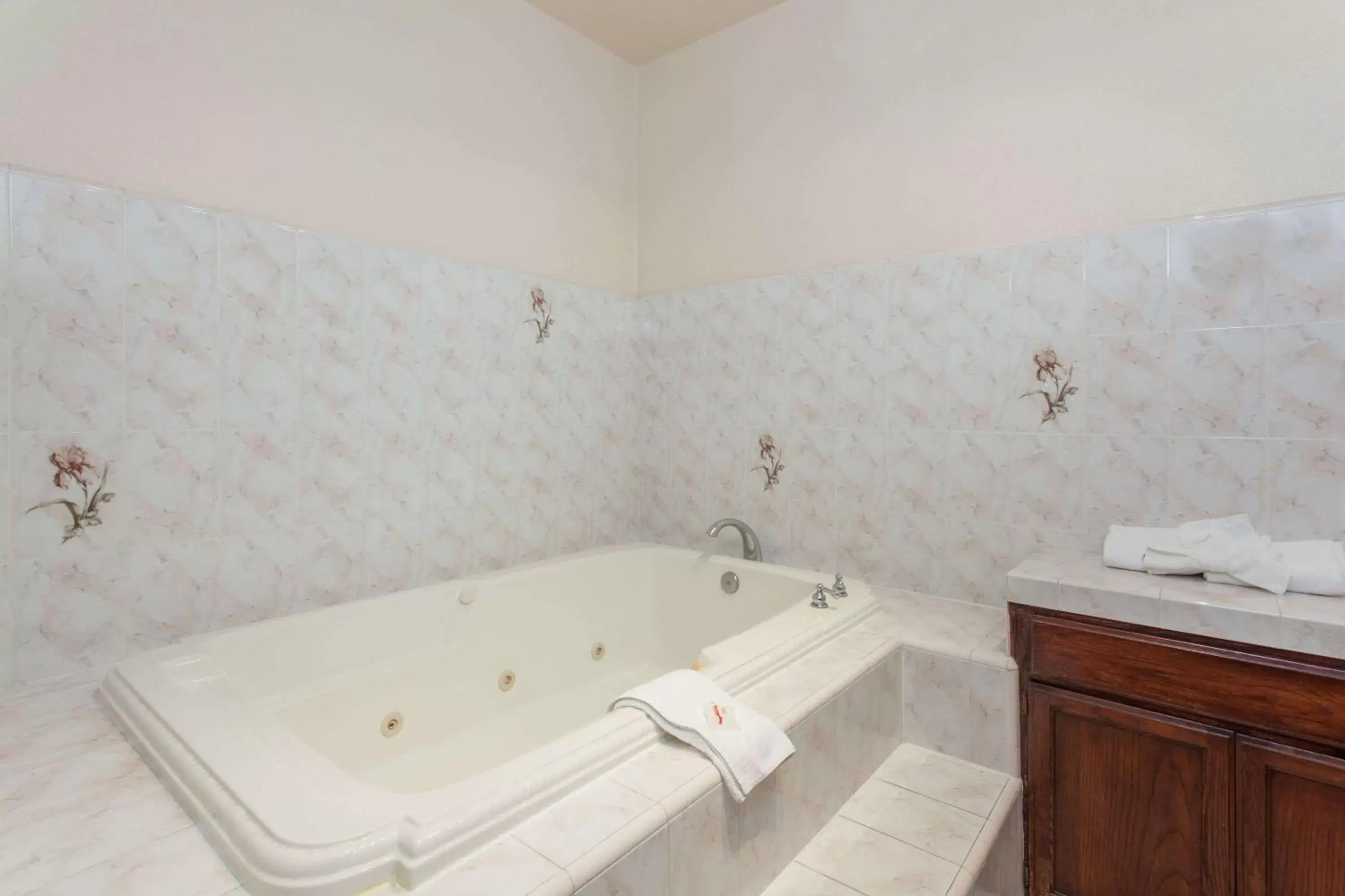 Bathroom in Ramada by Wyndham Fresno Northwest